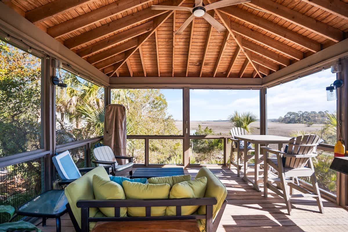Lovely outdoor screened in living area with spectacular marsh views