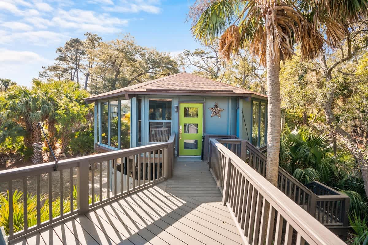 Lovely outdoor screened in living area with spectacular marsh views