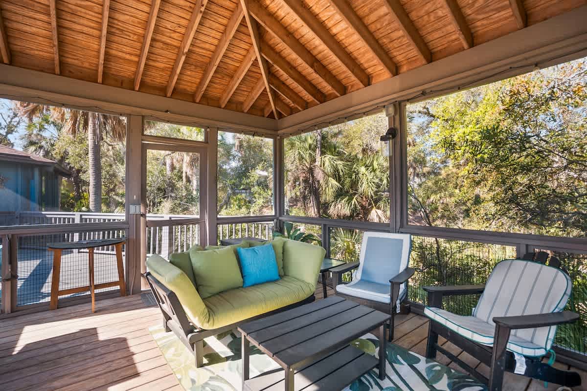 Lovely outdoor screened in living area with spectacular marsh views