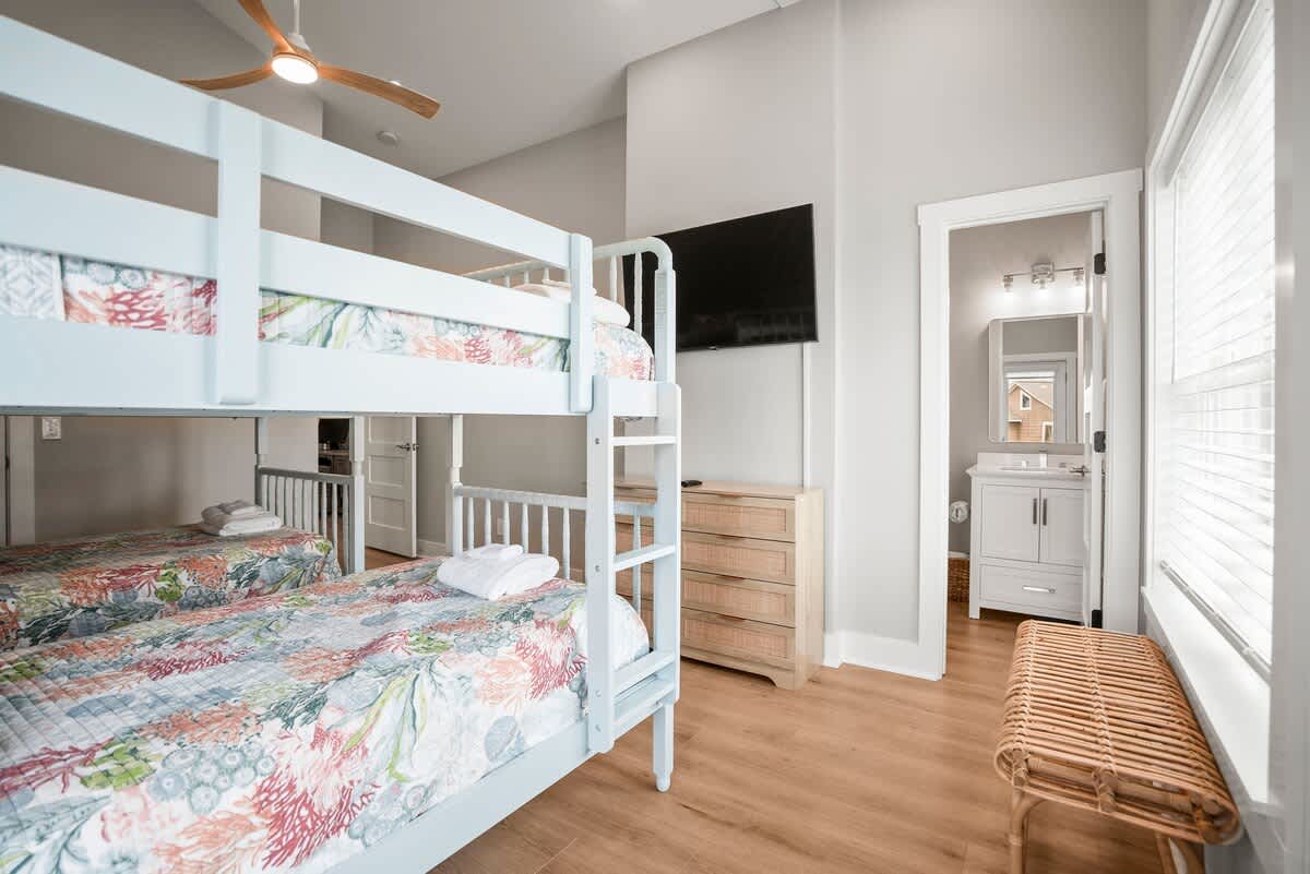 Second floor bunk bedroom with en suite bathroom and balcony