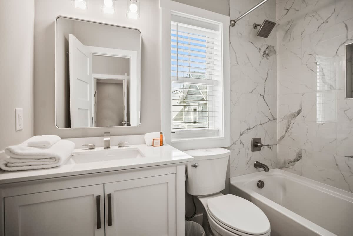 Second floor guest bedroom with en suite bathroom and balcony