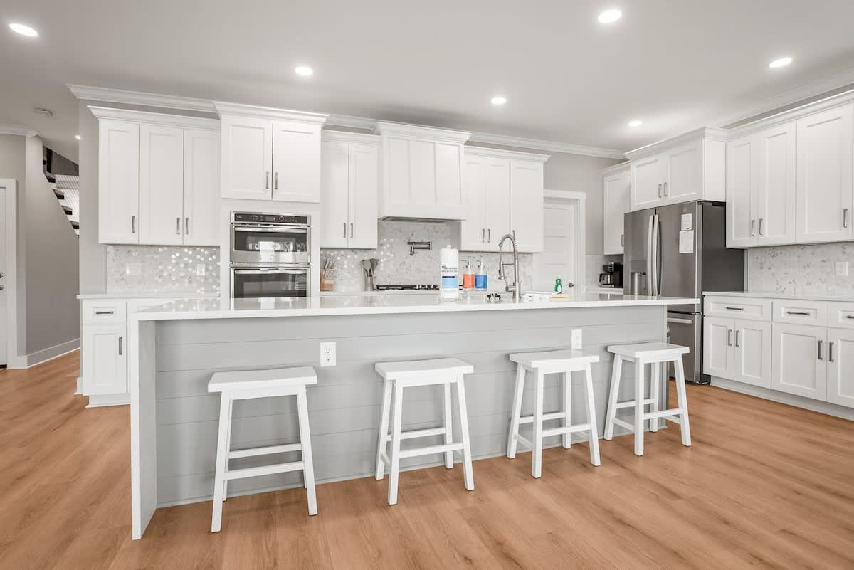 Modern kitchen with open concept dining and living room