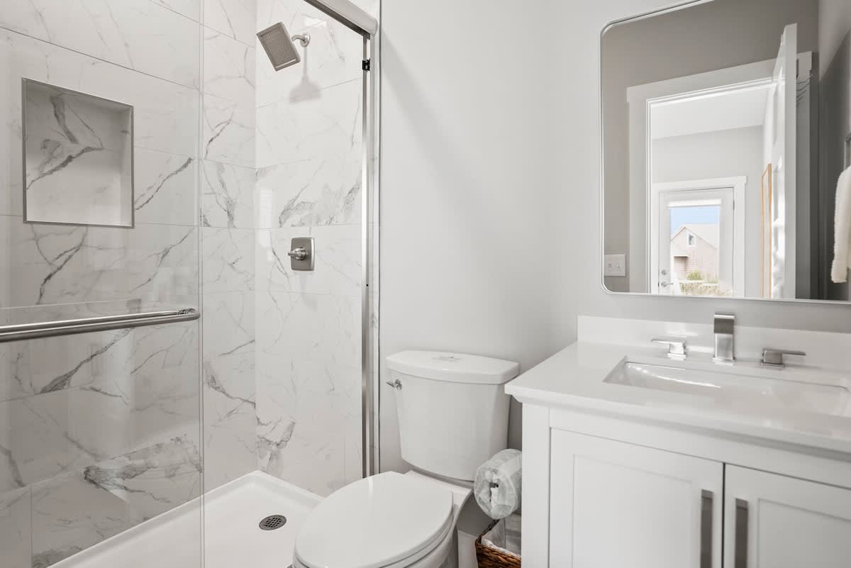 Second floor bunk bedroom with en suite bathroom and balcony