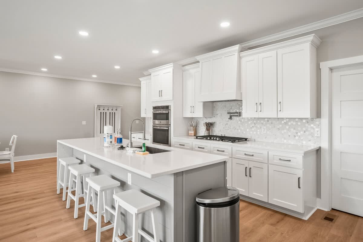 Modern kitchen with open concept dining and living room