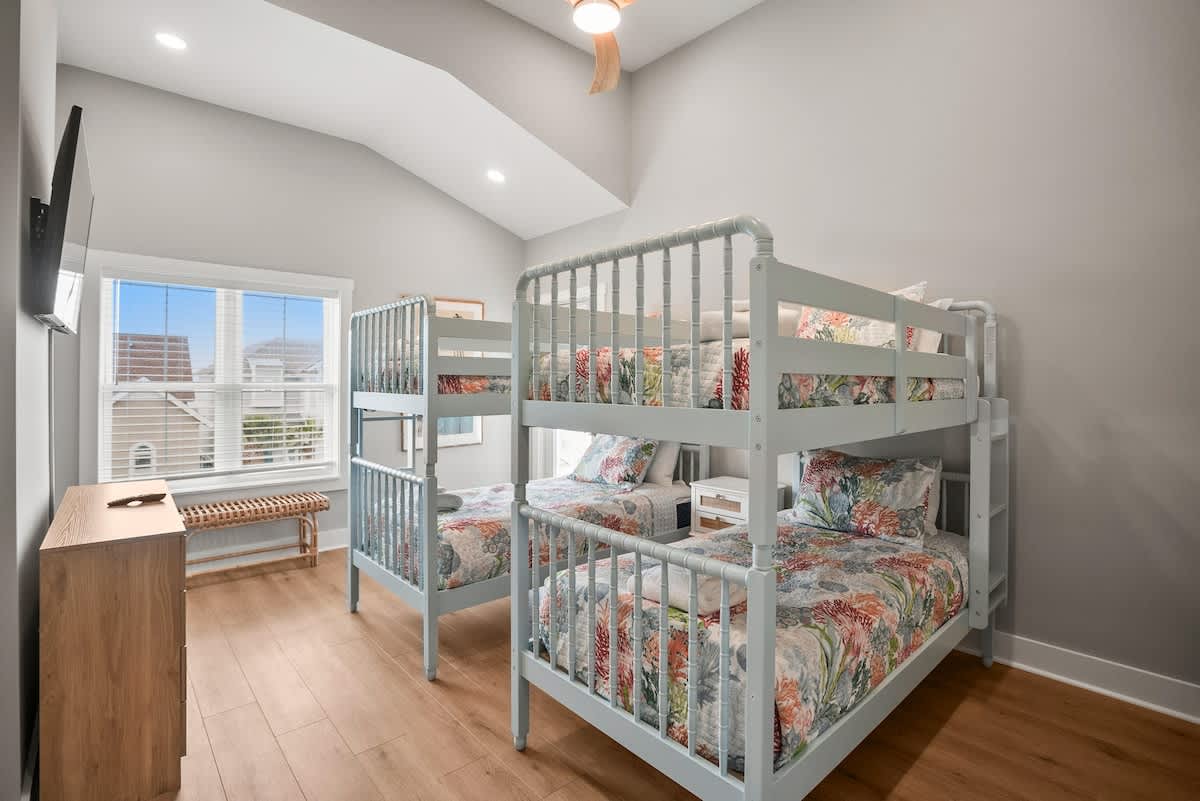 Second floor bunk bedroom with en suite bathroom and balcony