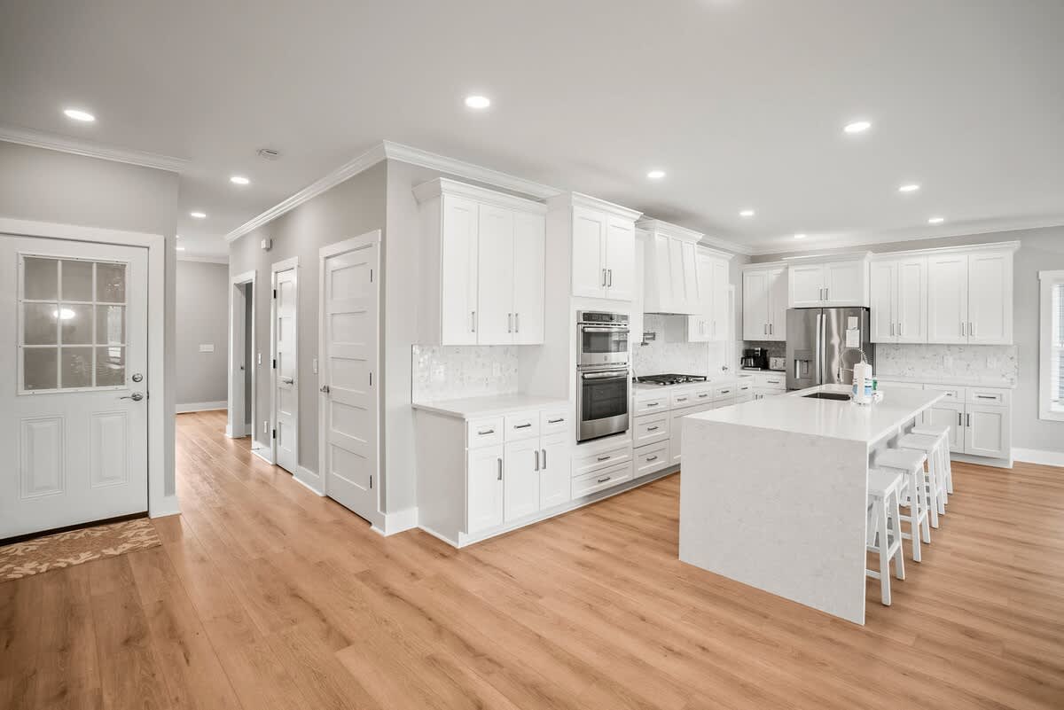 Modern kitchen with open concept dining and living room