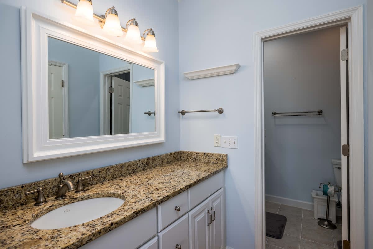 First floor primary bedroom and en suite bathroom