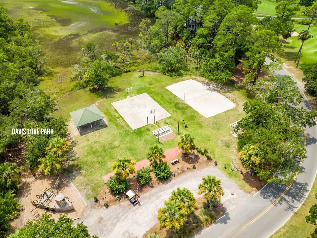 Aerial View of Davis Love Park Featuring playground, basketball court, and volleyball court
