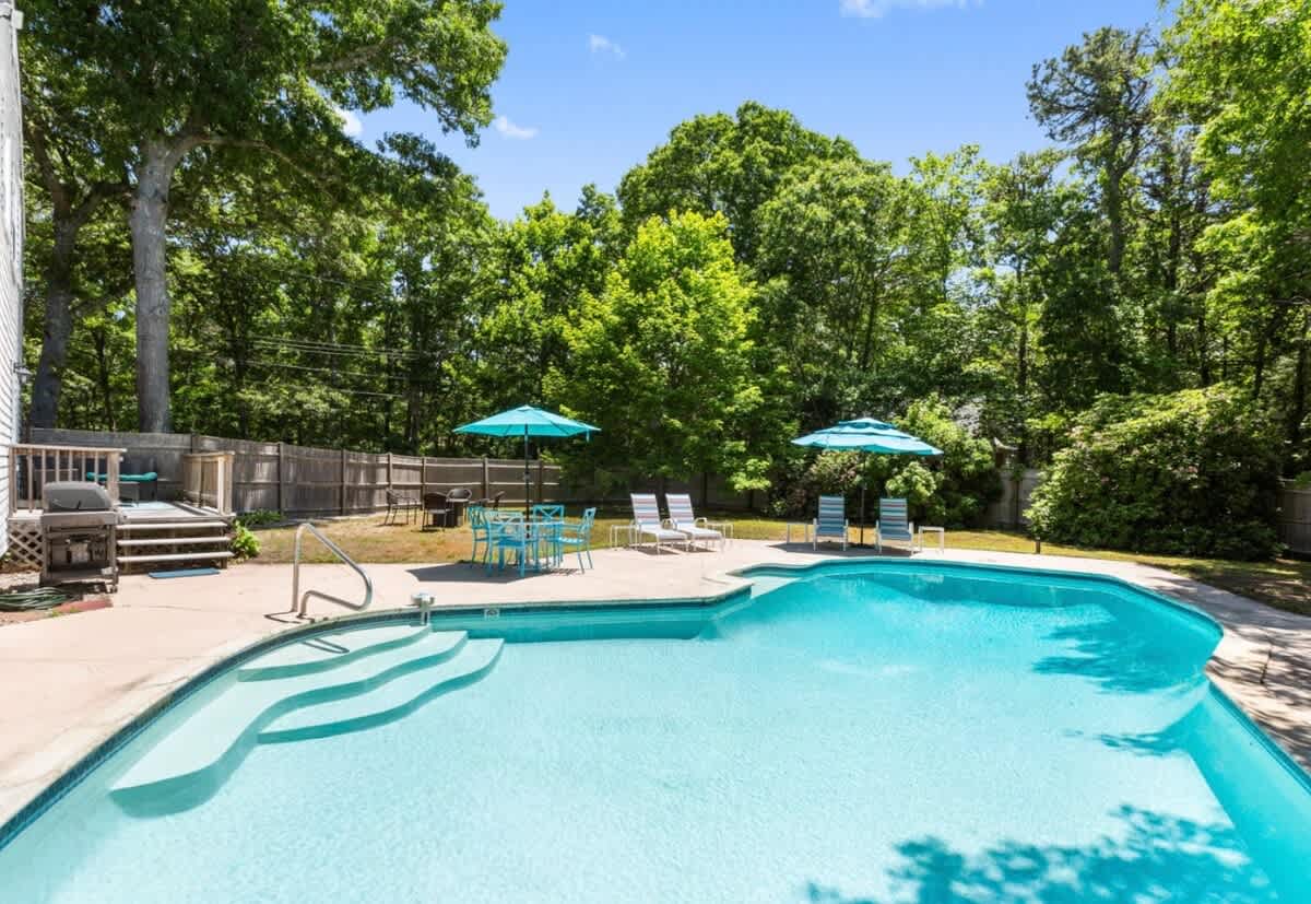 Escape and Relax in this East Orleans home with magnificent in ground heated pool