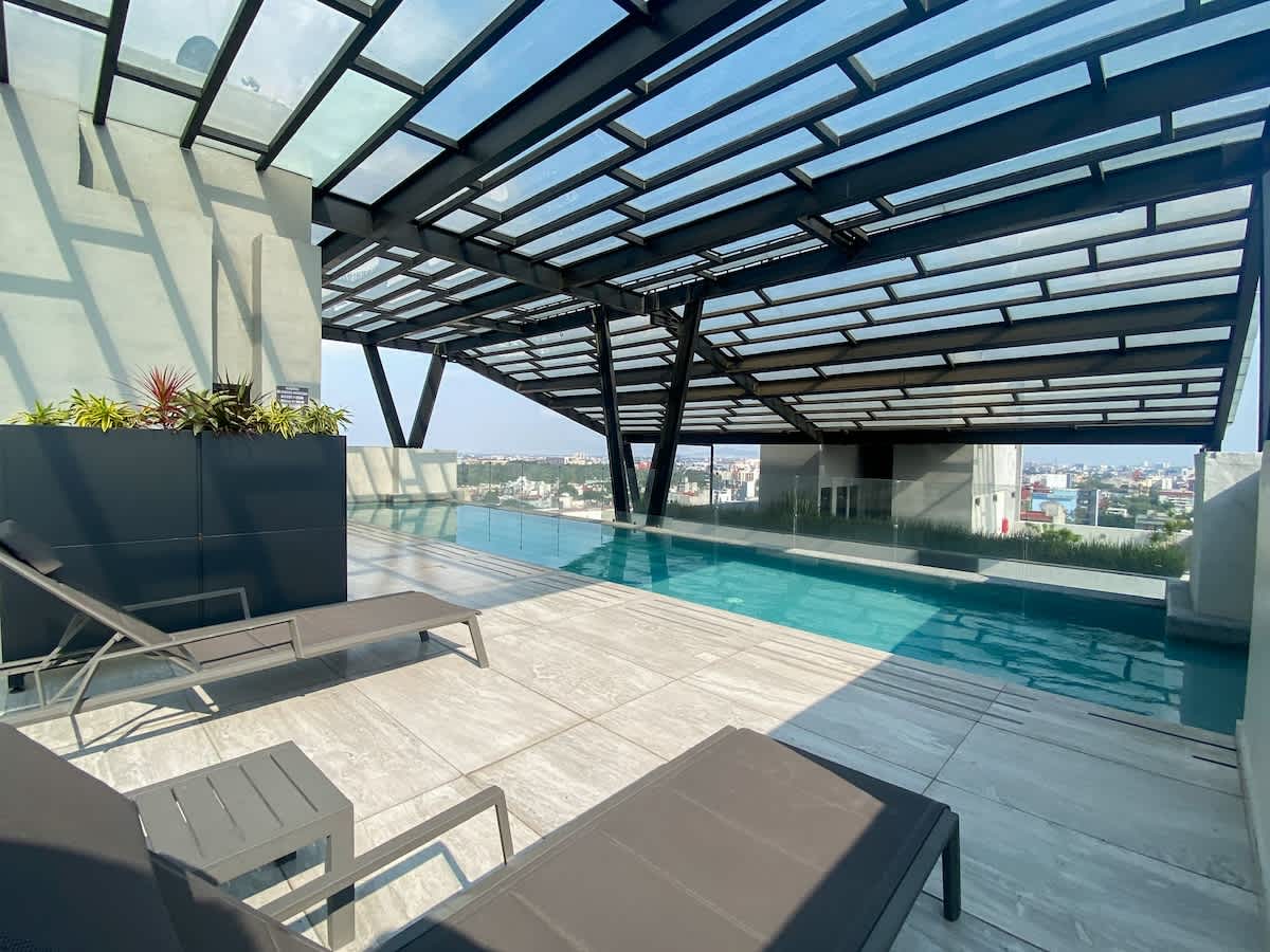 Outdoor pool with city skyline view