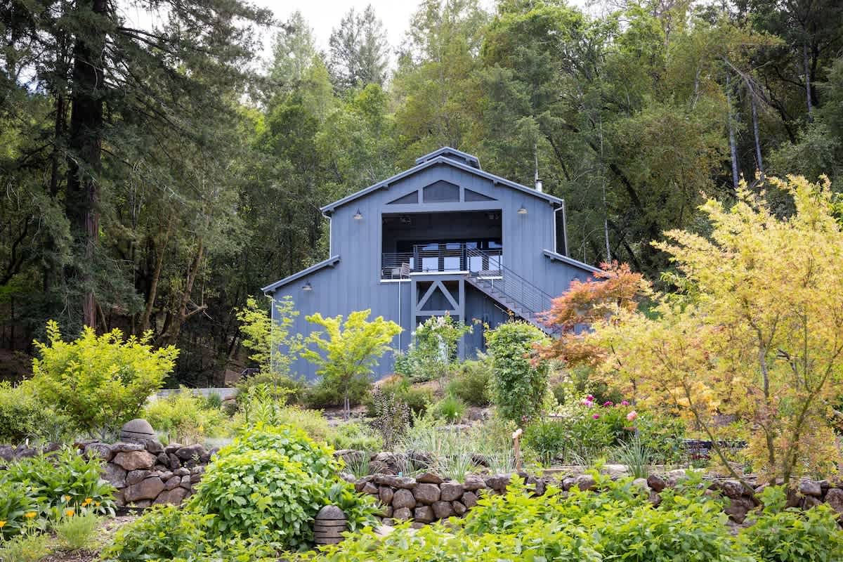 The Barn house perched above 1-acre garden