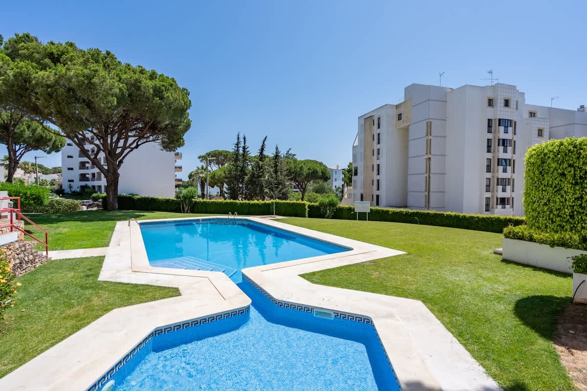 Sunny Escape with a Pool & Balcony by HostWise