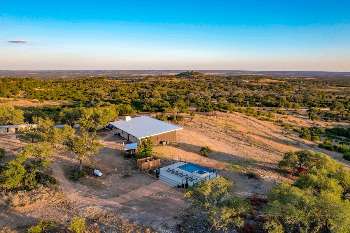 Another aerial view of the property and pool.