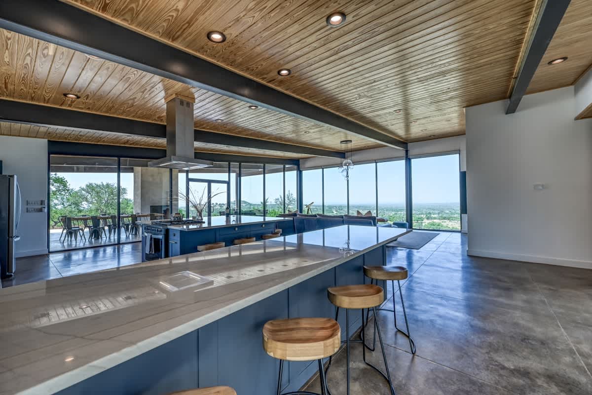 This space features a stylish wrap-around bar seating perfect for enjoying the view with family and friends.