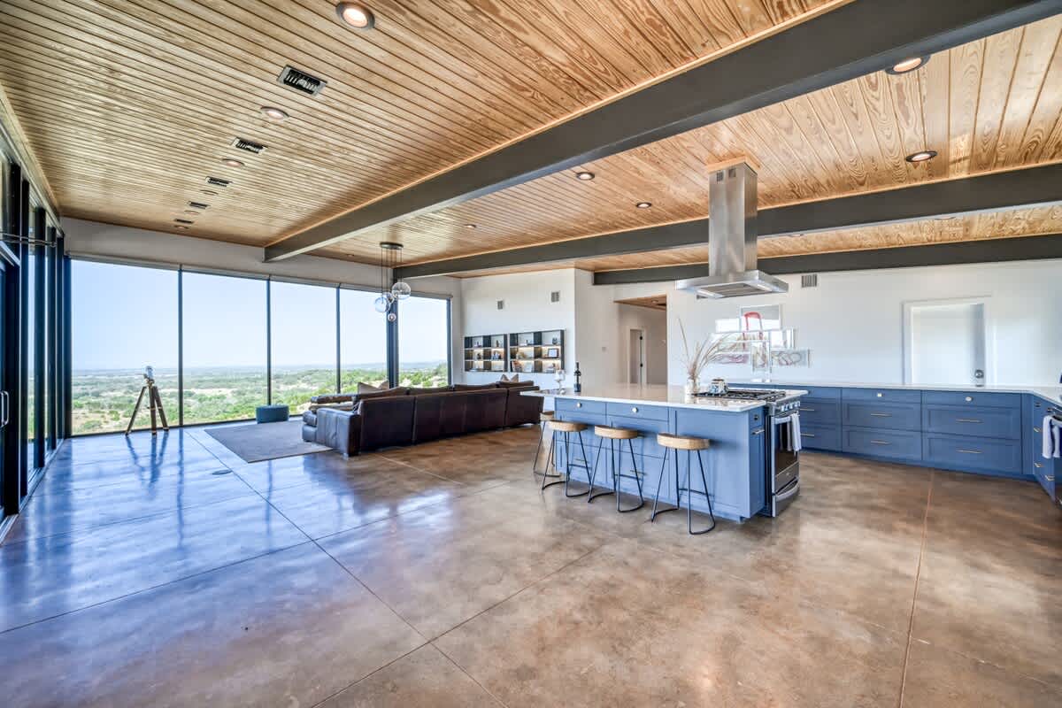 Check out this sleek and modern kitchen with an open concept design!