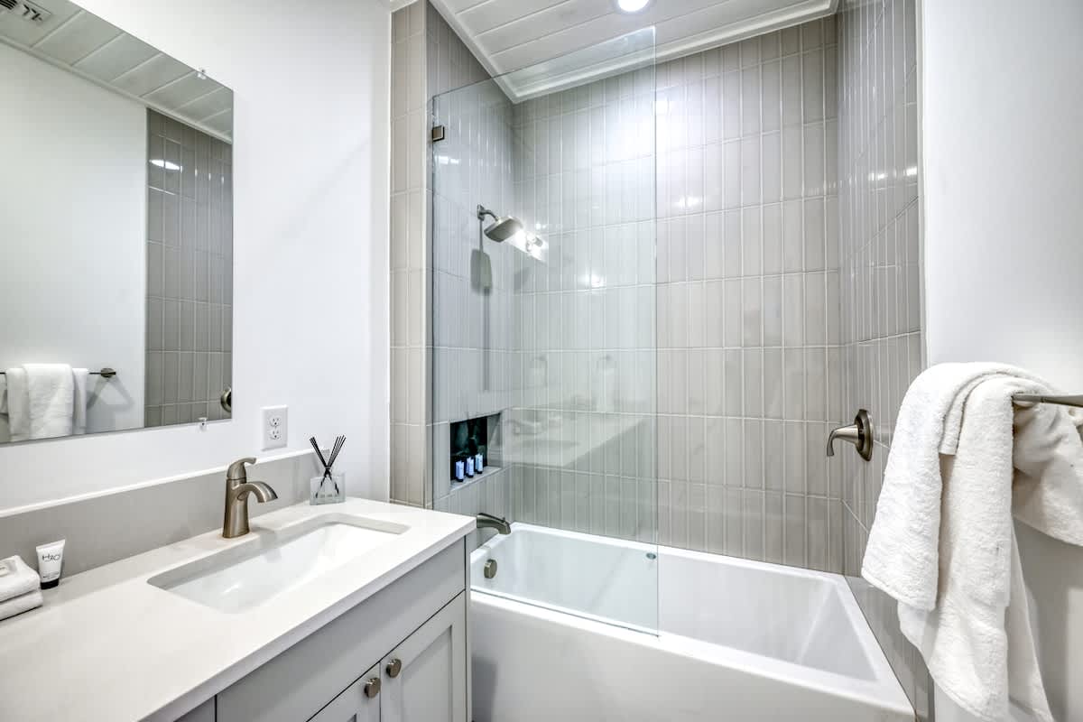 Take a relaxing soak in the master bathroom tub.