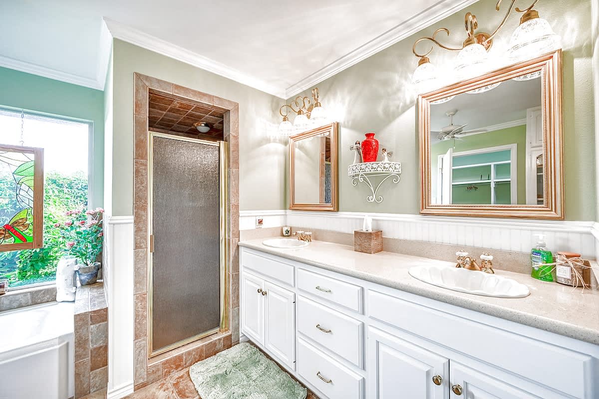 Master Bathroom with double vanity and separate shower. 