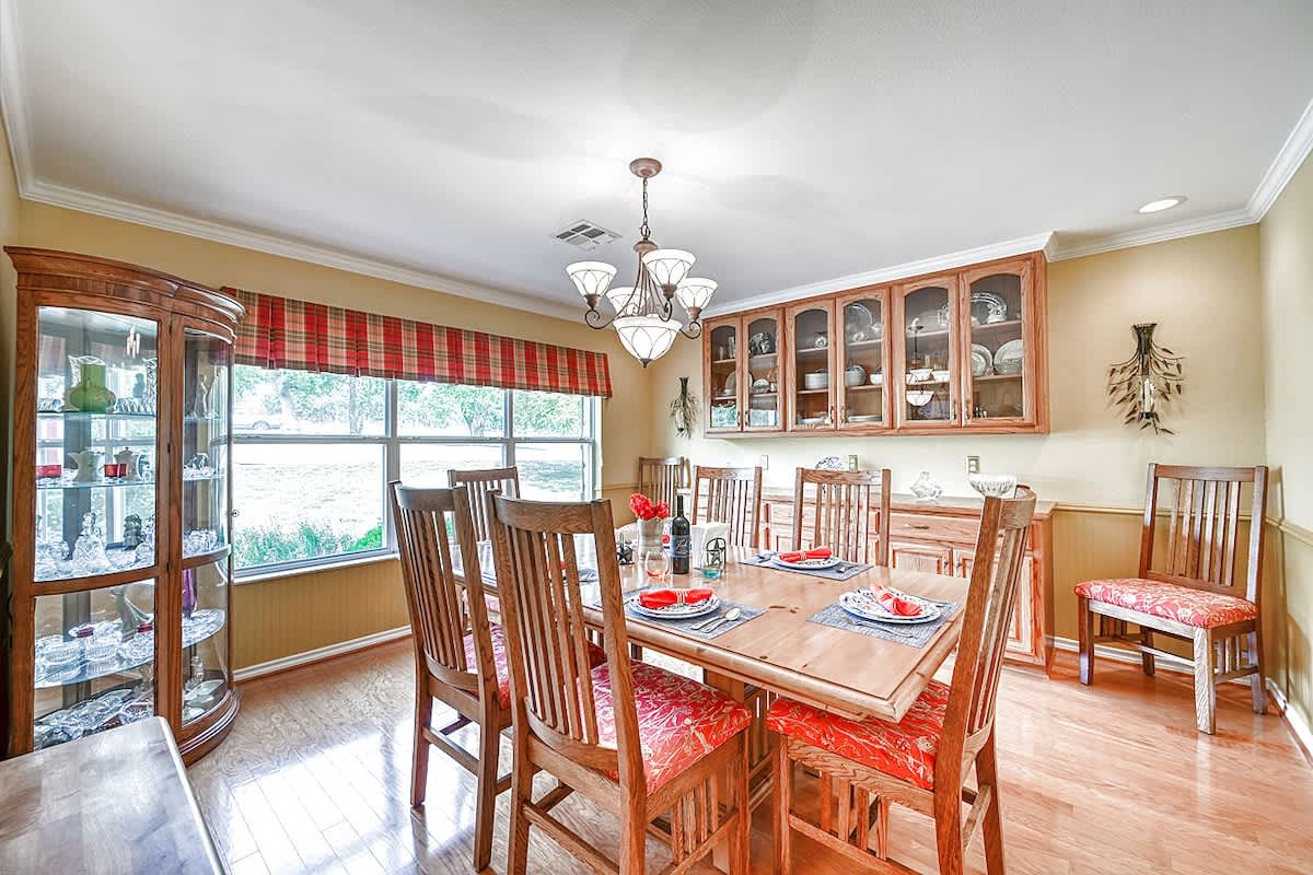 Perfect setting for a family meal with a formal dining room featuring seating for 8. 