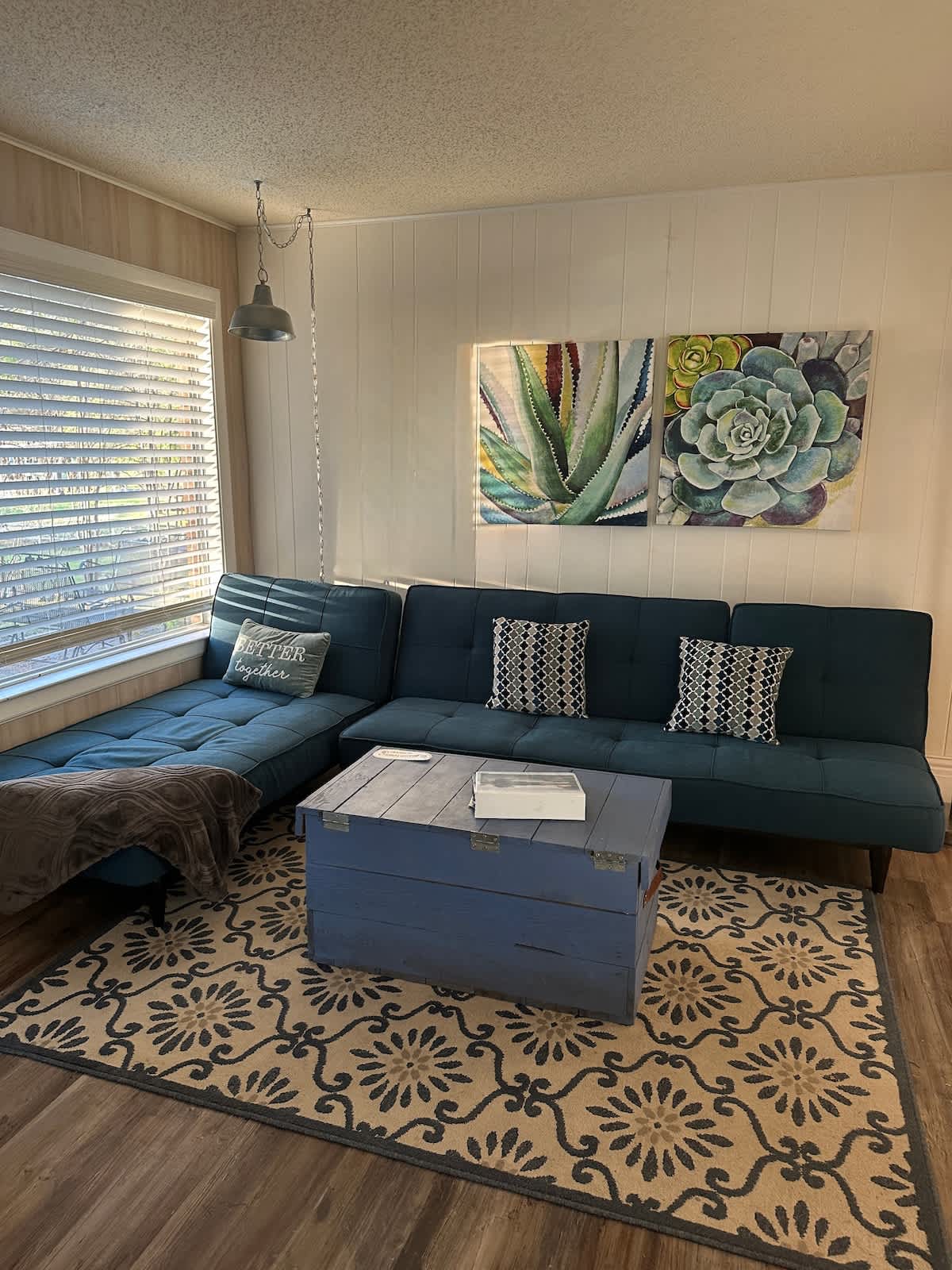 Versatile full futon and twin chaise lounge, providing comfortable seating during the day and sleeping arrangements at night.