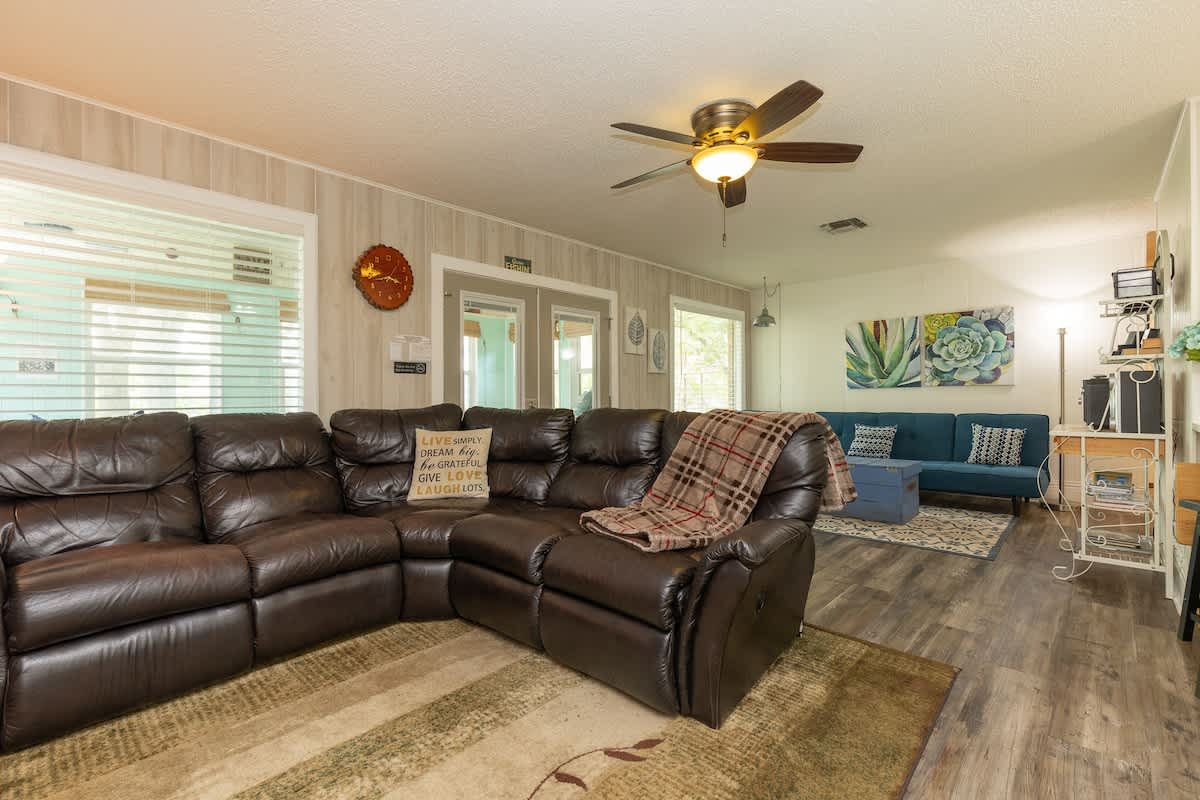 Bring everyone together in the spacious living room, featuring ample seating for the whole family to relax, watch TV, or enjoy quality time together