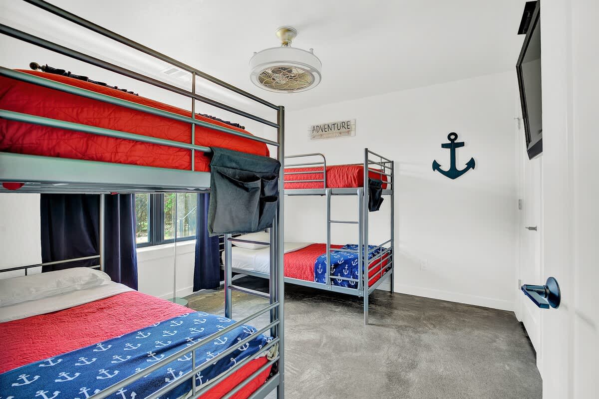 Cozy bedroom 3 with two sets of twin over twin bunks, perfect for kids' sleepover.