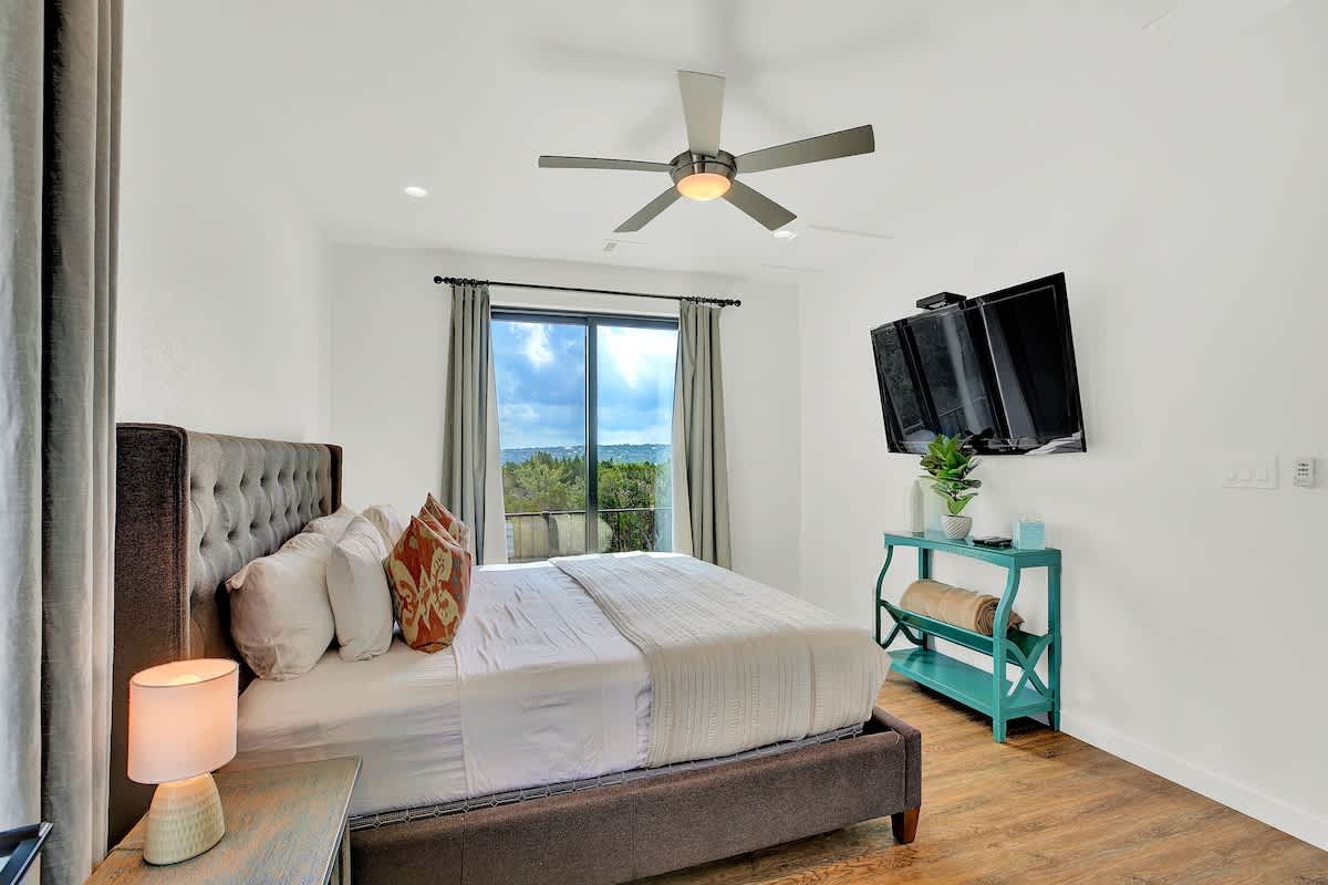 Relax and unwind with a movie on the flat-screen TV in the spacious master bedroom.