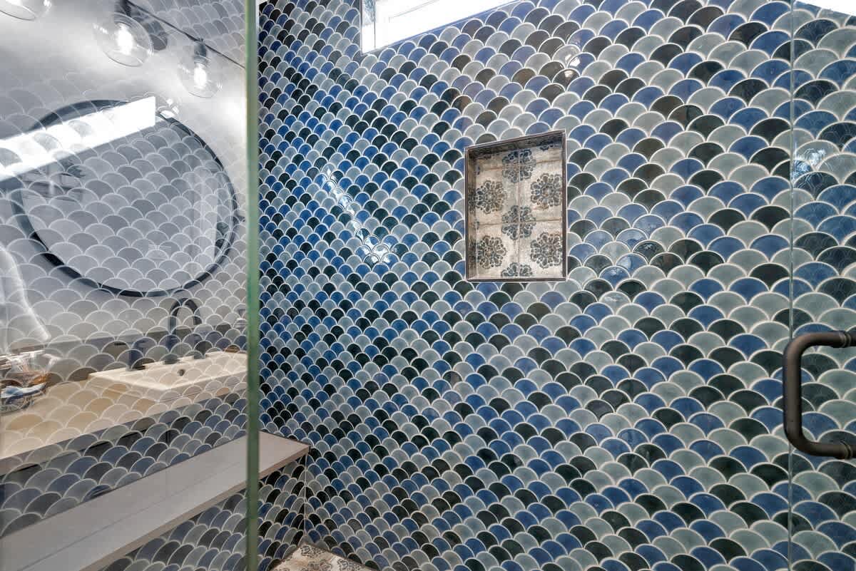 Spacious walk-in shower with built in bench.