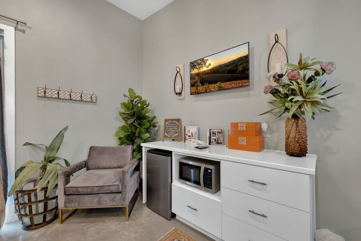 Kitchenette with mini fridge and microwave.