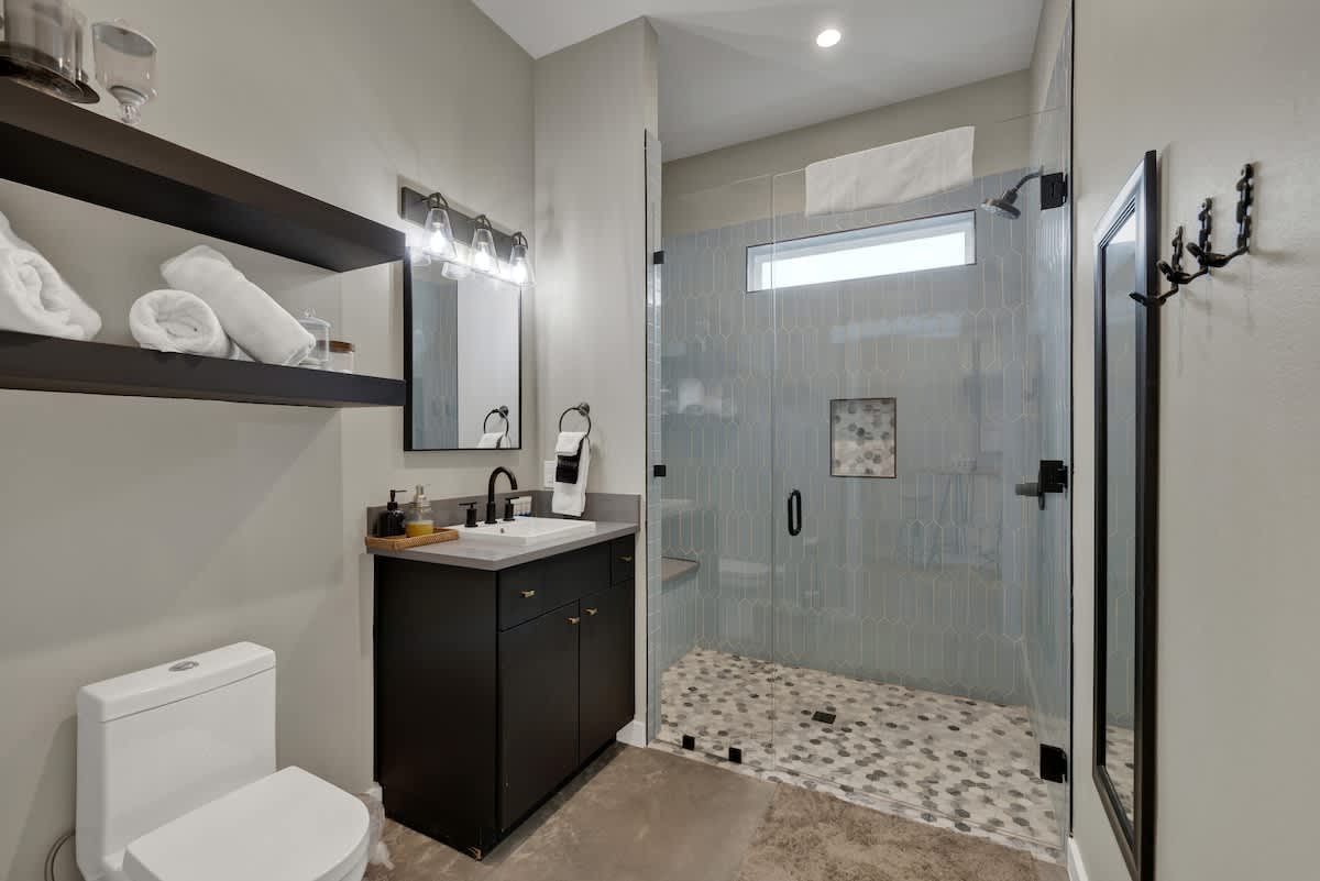 Full bathroom with walk in shower.
