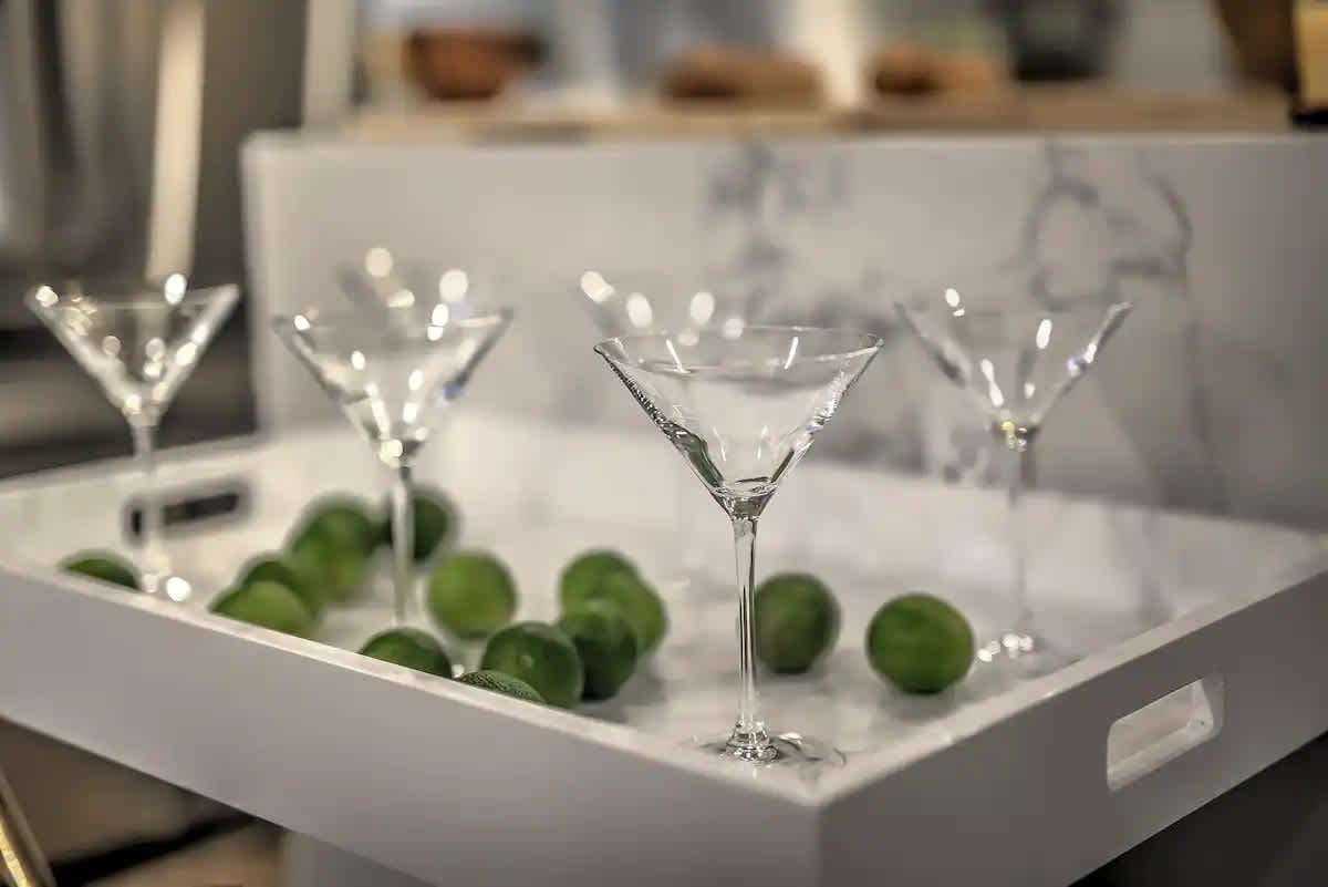 A crisp and classy bar moment featuring martini glasses and limes, ready to elevate your cocktail hour.