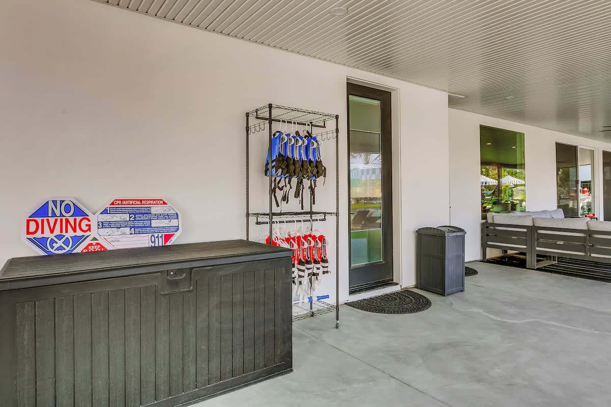 Stay refreshed and organized at this convenient outdoor station stocked with towels and poolside accessories. Located just steps from the water for effortless relaxation.