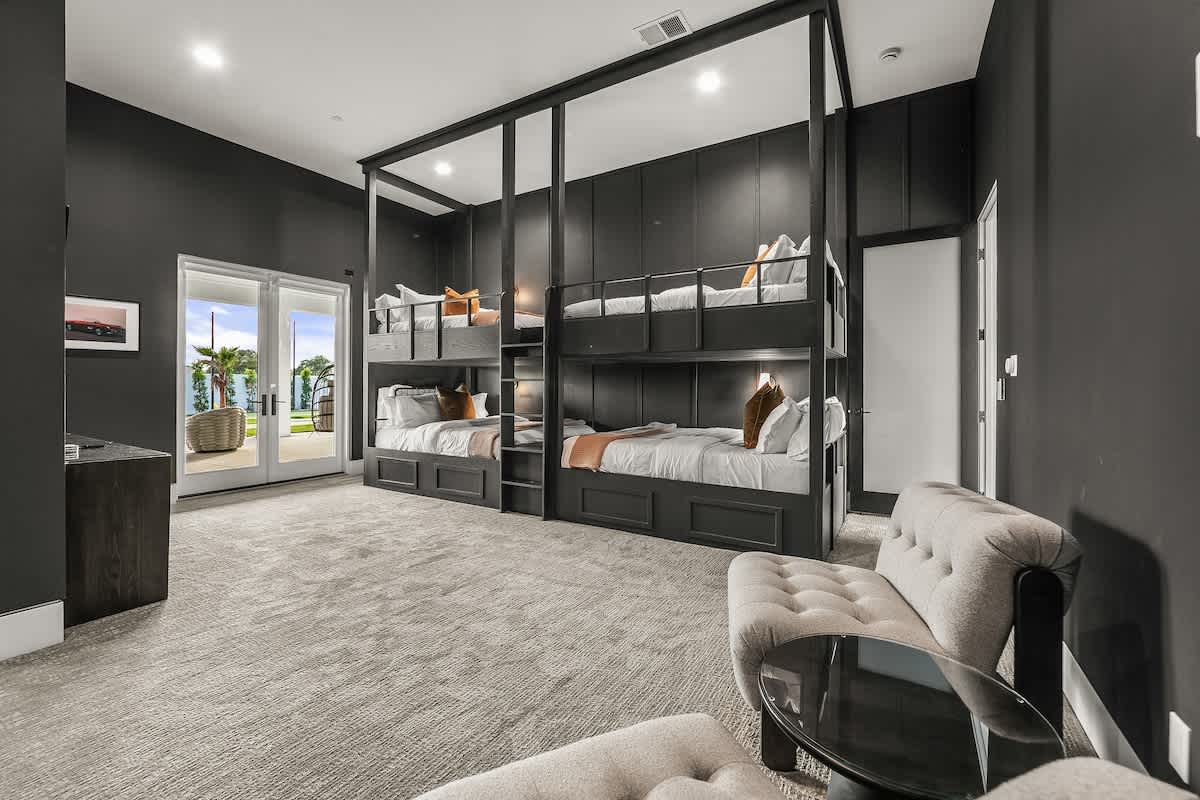 2 Custom Queen-sized bunk beds with Full bathroom attached. Sono Speakers attached to TV