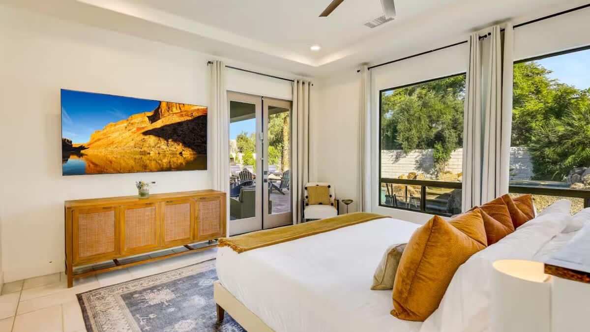 65 inch TV with entrance to the backyard