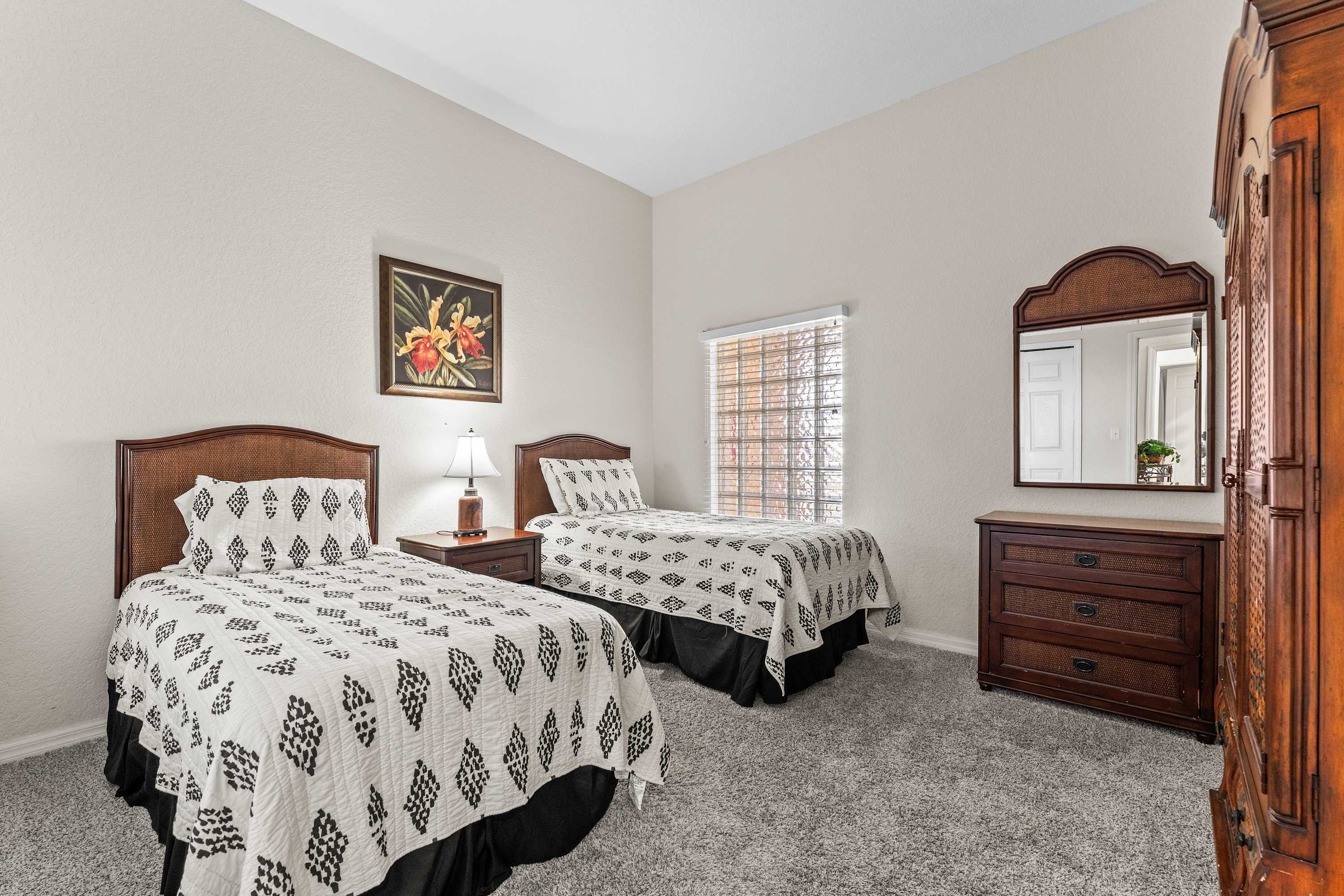 This bedroom retreat features two cozy twin beds