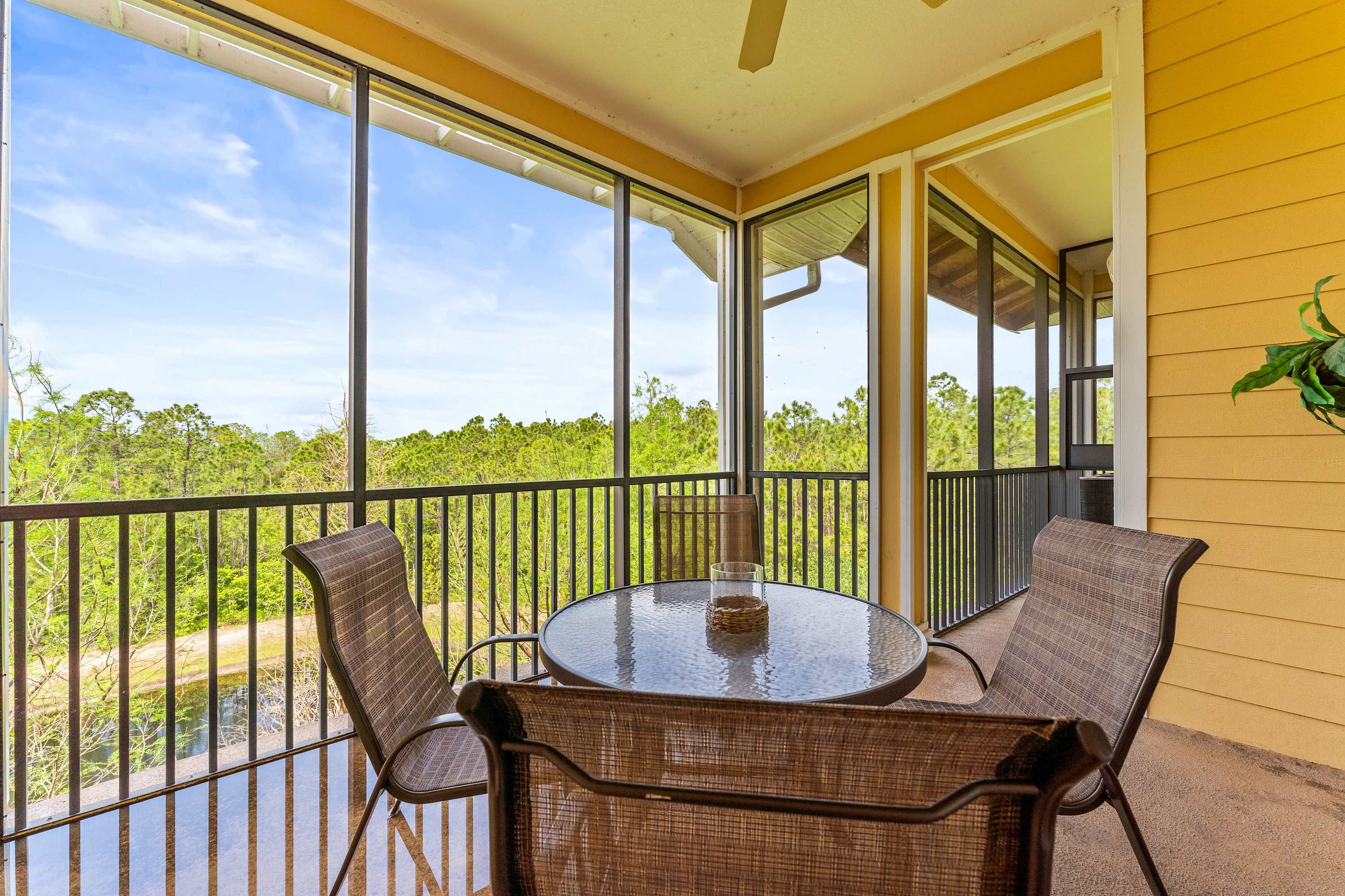 Enjoy the fresh air on the screened in balcony