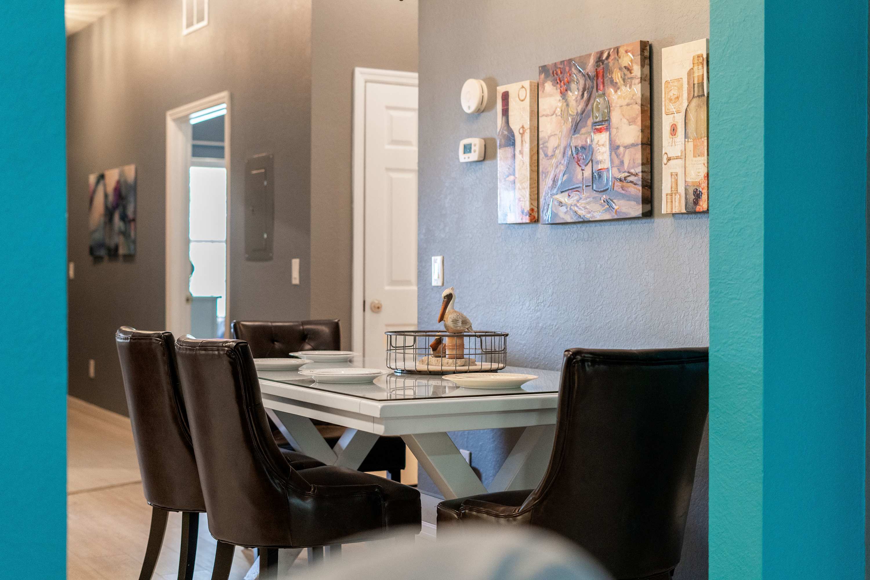 Gather for elegant meals together at the dining table, offering seating for 4