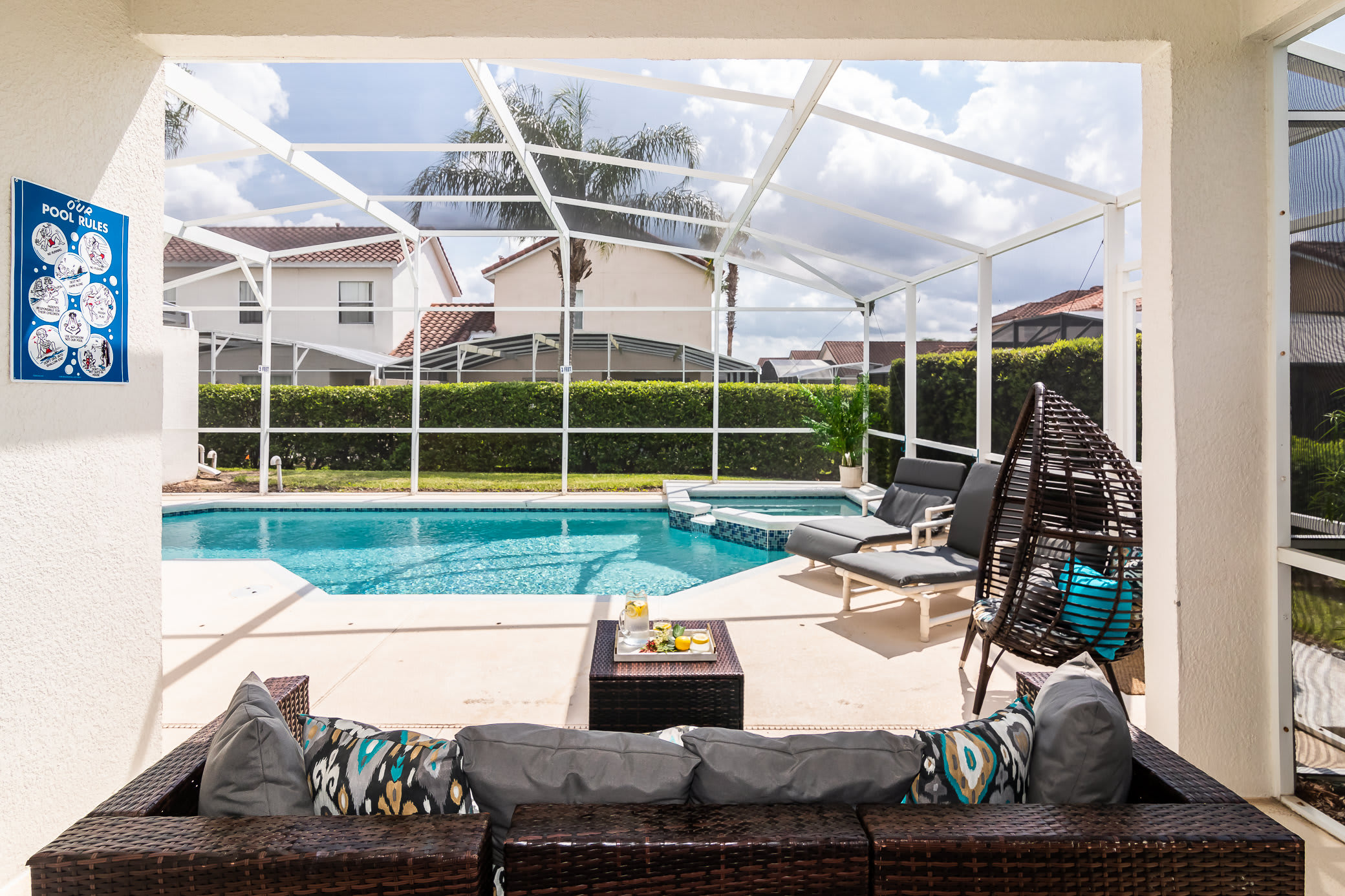 Gated pool with lots of outdoor seating