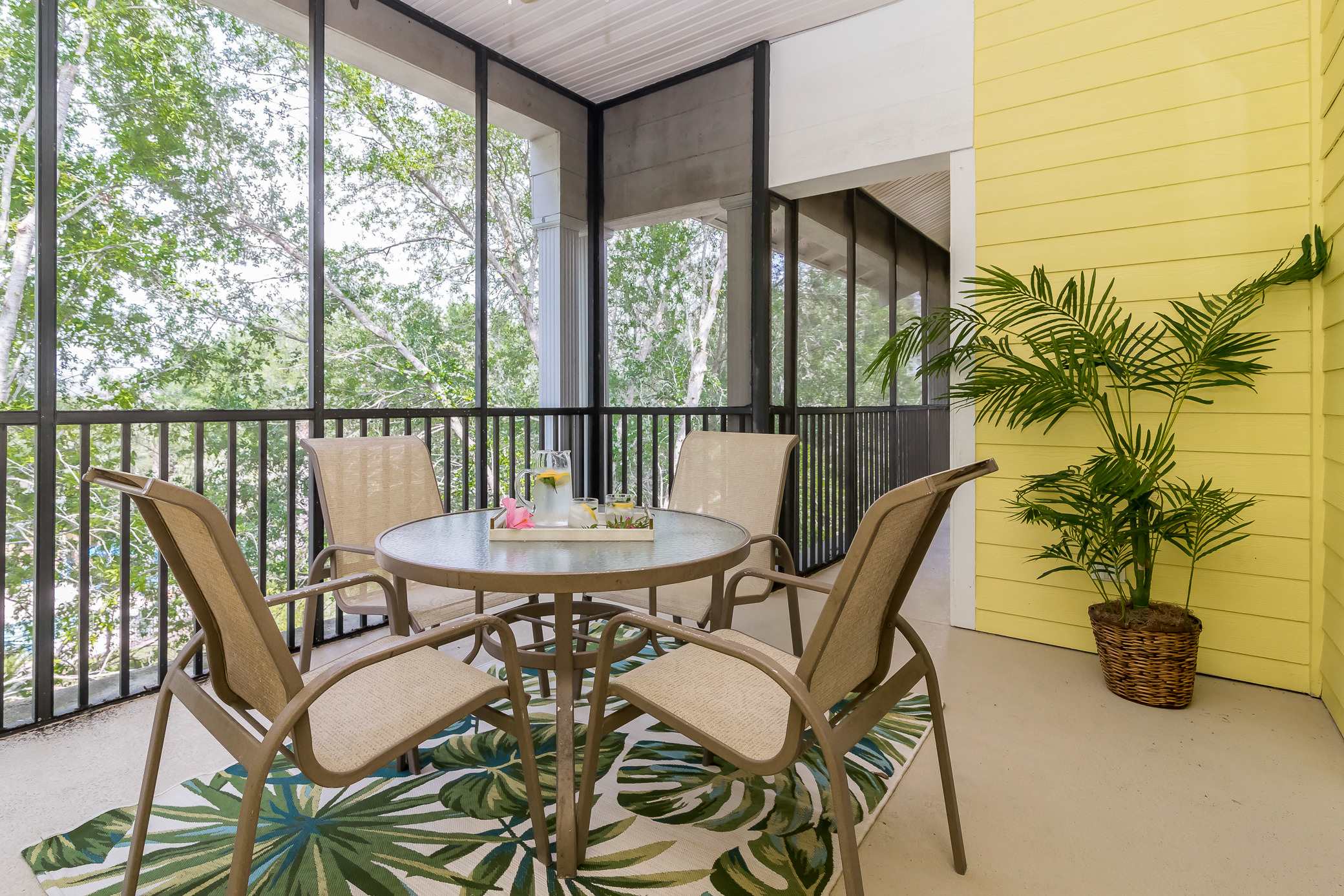 Screened HUGE balcony outside of bedroom 3 with outdoor seating