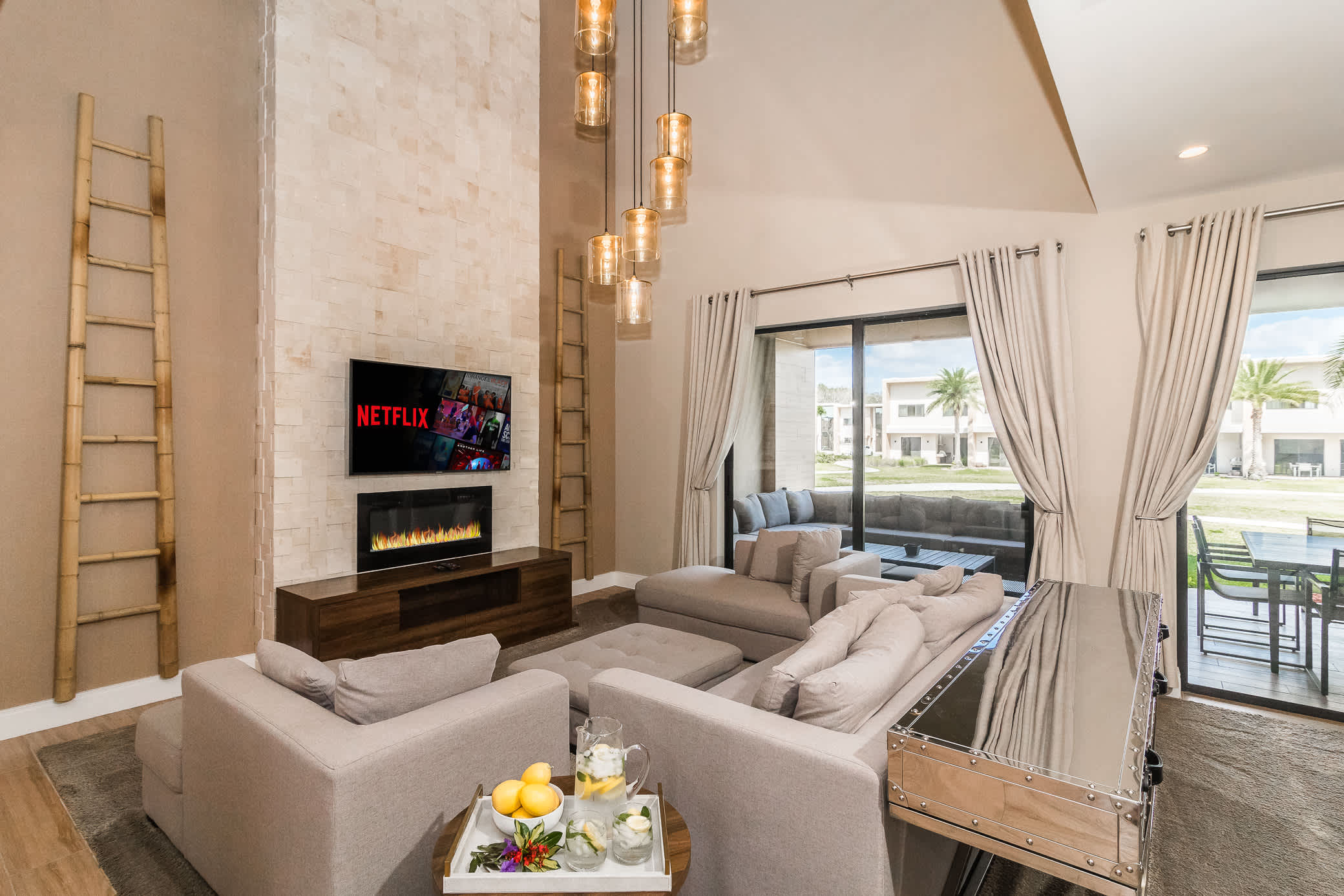 Open living space with Smart TV, fireplace, and patio access