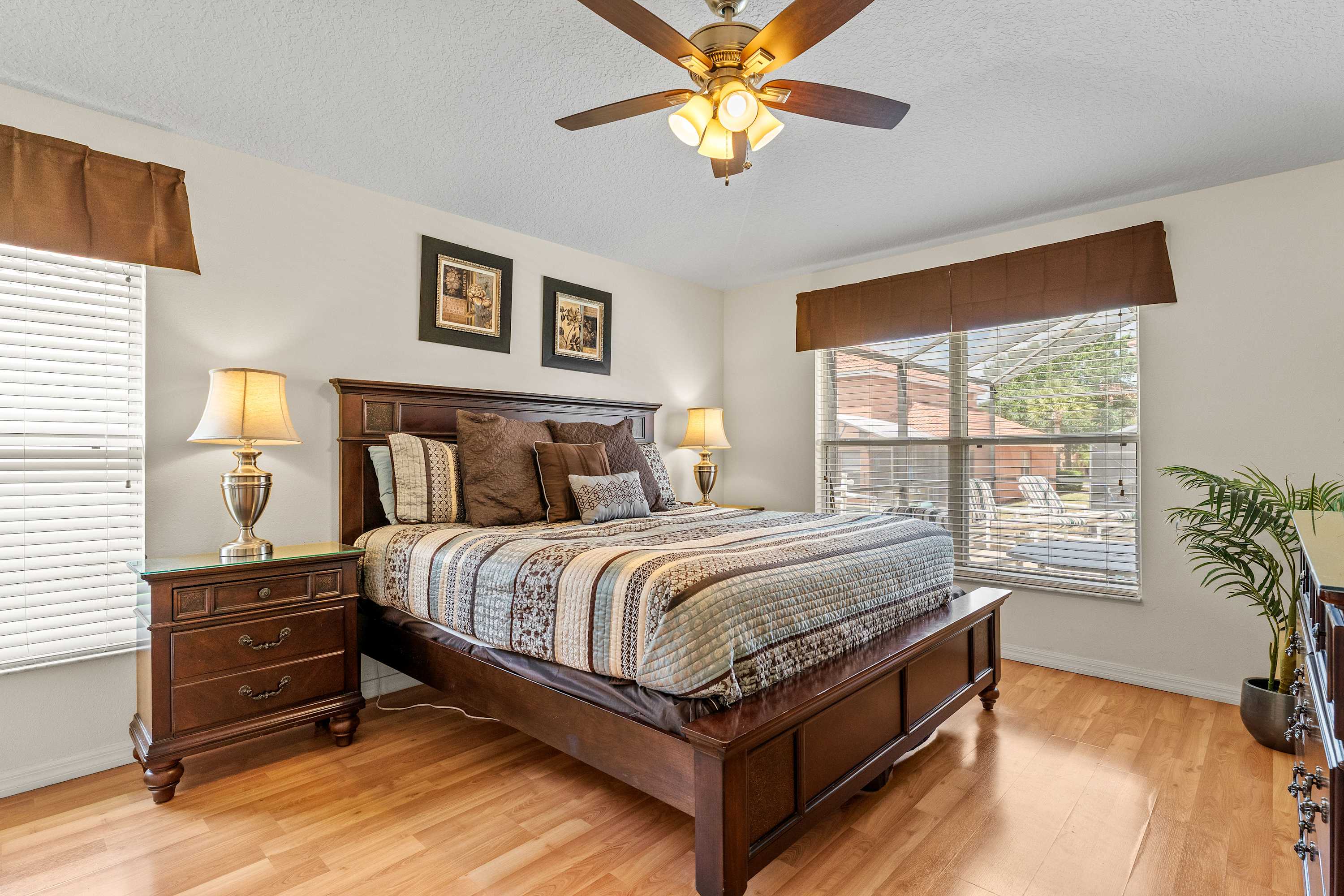 Cozy bedroom with queen bed, Smart TV, ceiling fan and ensuite