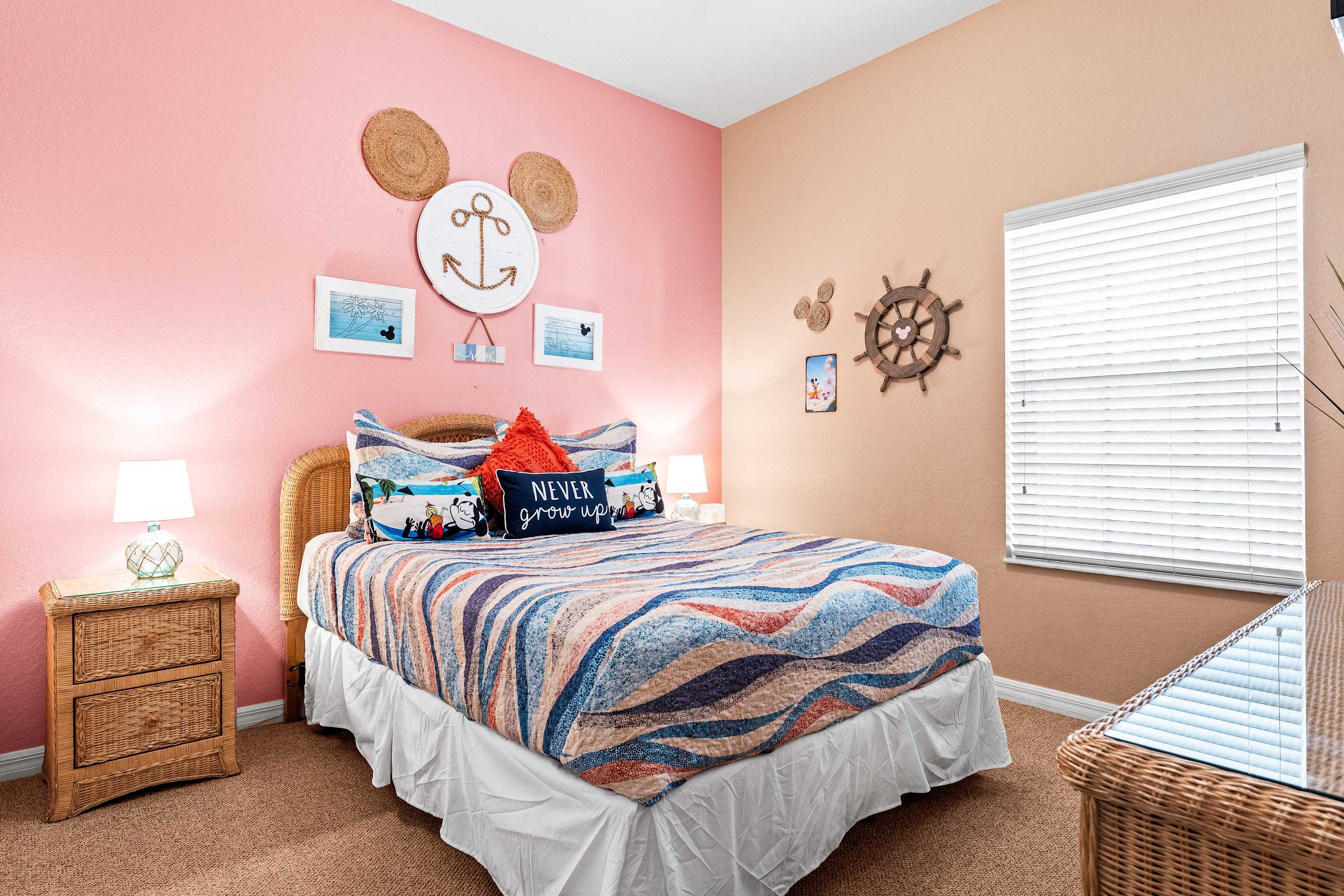 Bedroom retreat showcases a chic queen bed & smart TV