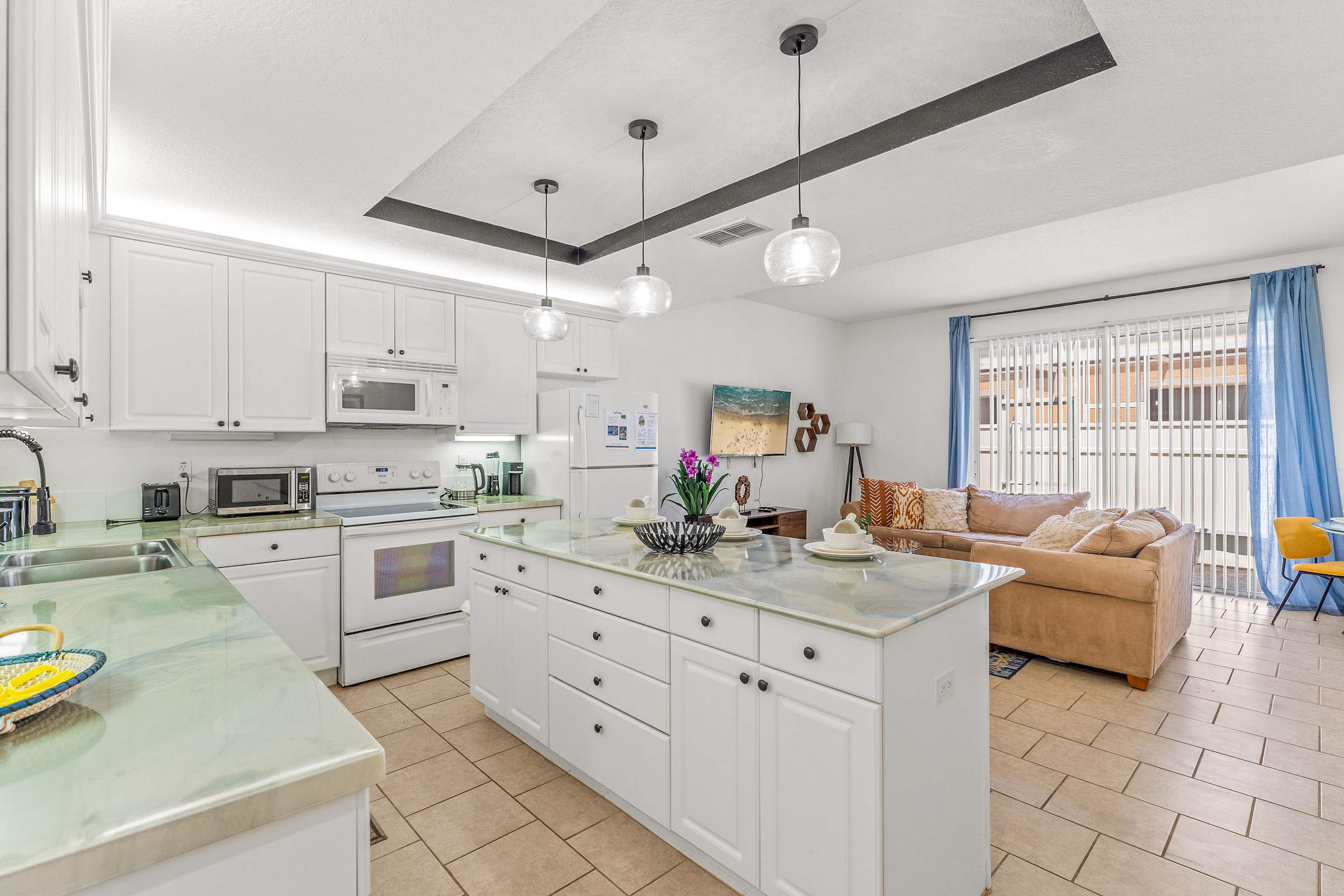 The kitchen offers ample storage space & all the comforts of home