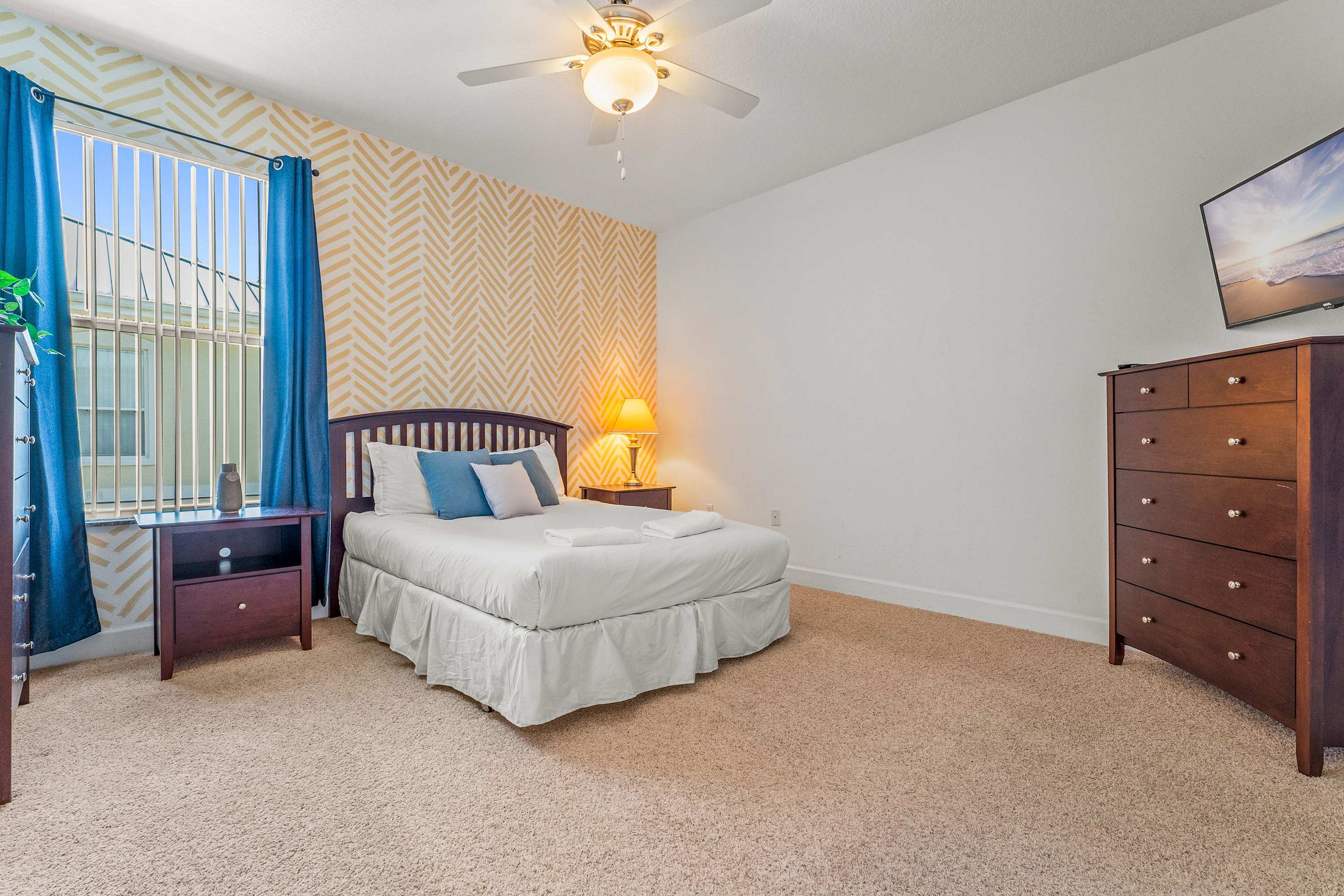 Relax in a serene king bedroom with ensuite bathroom & ceiling fan