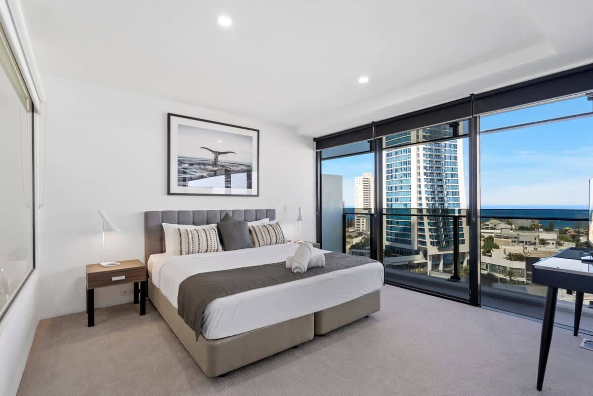 Master bedroom with king bed and ocean views. 