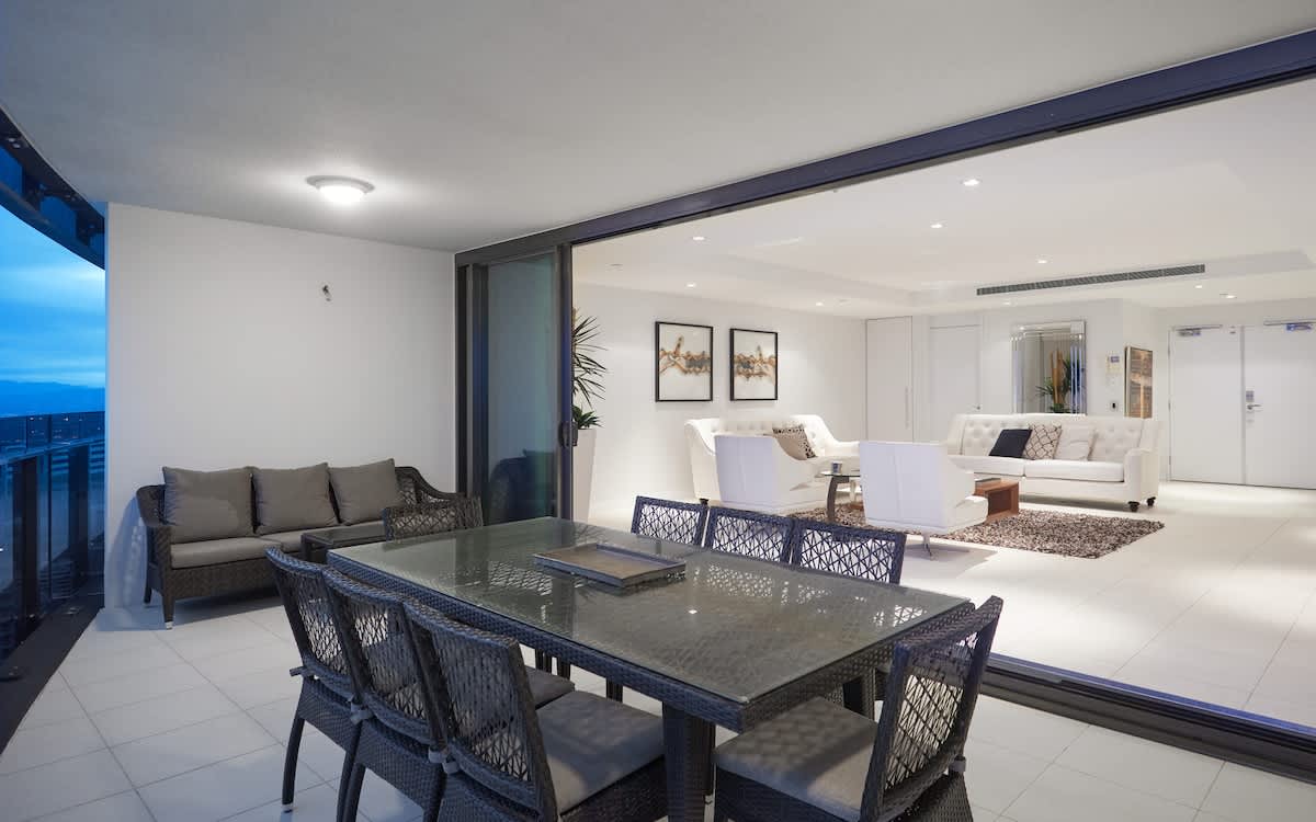 Outdoor dining on level 41, with indoor/outdoor flow to the main living area. 