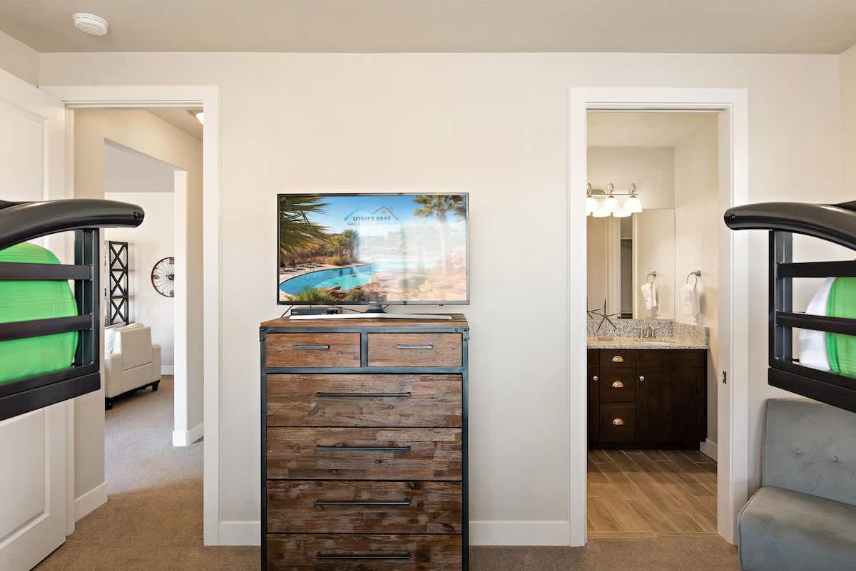 Bedroom 4 on 2nd floor with TV and 2 bunks sleeps 8