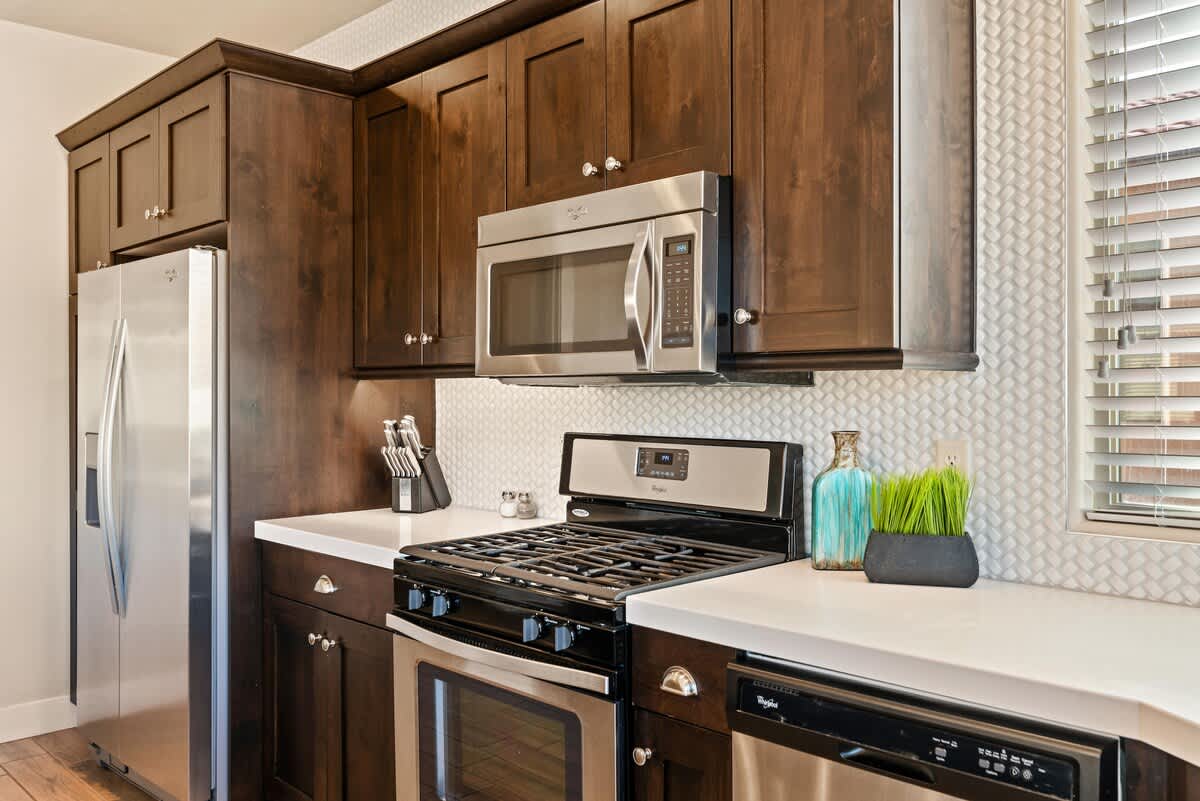 Kitchen stocked with appliances and utensils for cooking