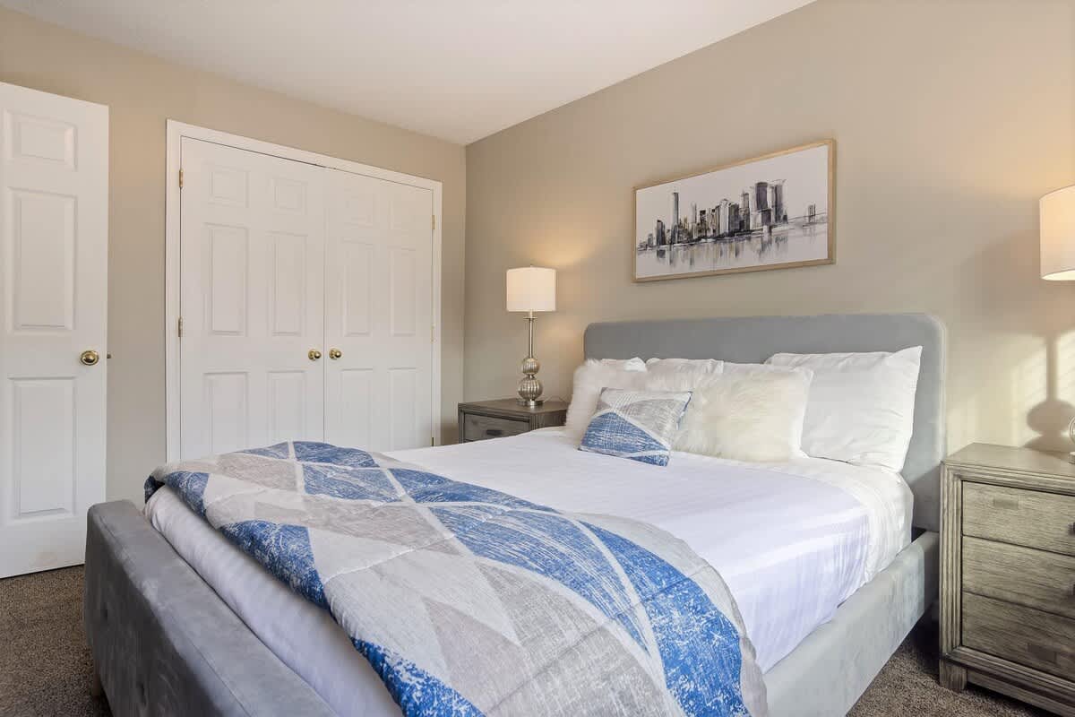 Bedroom 2 with queen bed and luxury linens