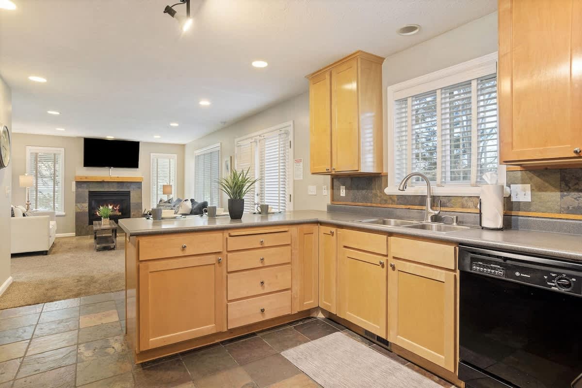 Kitchen opens to comfortable living room TV lounge area