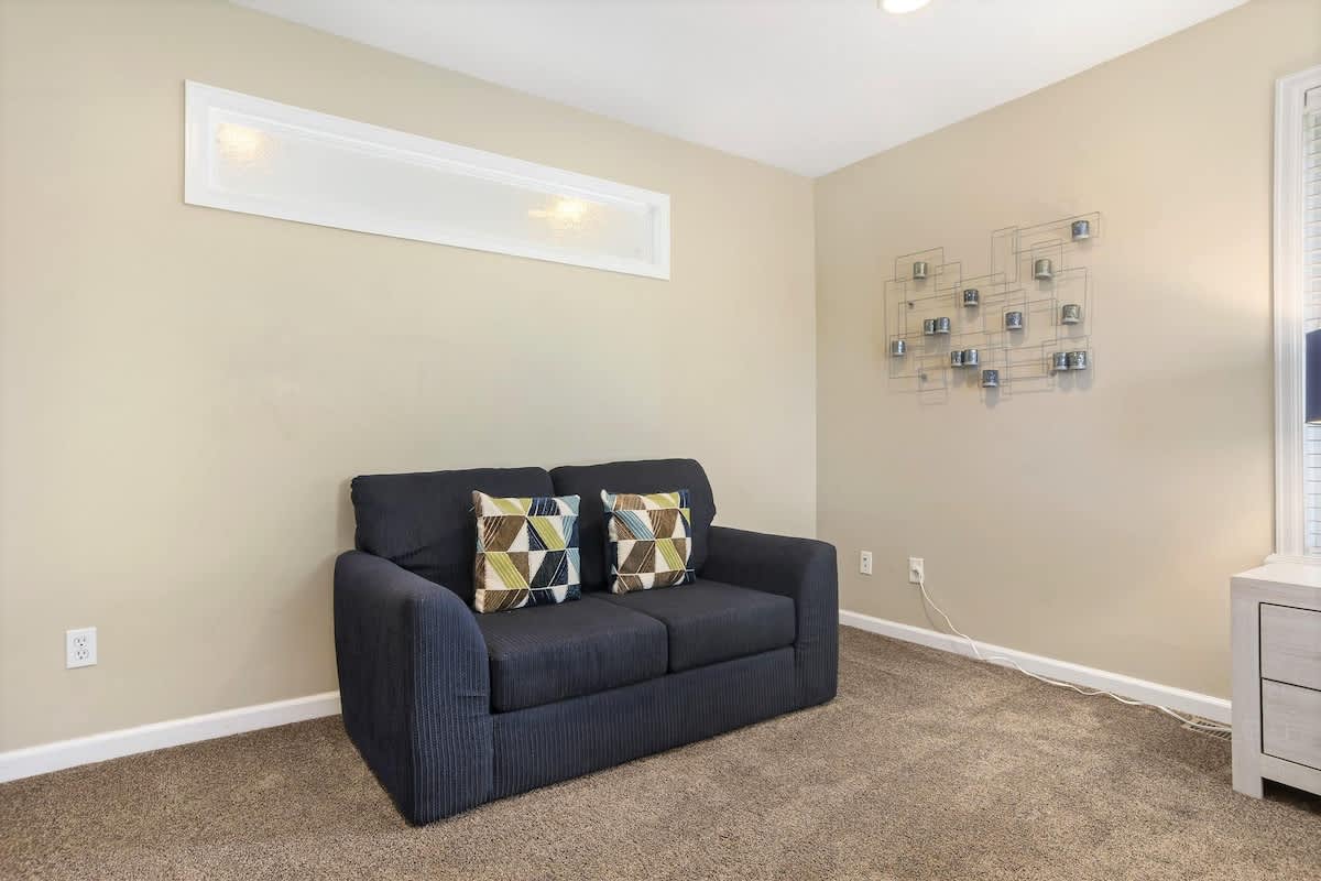 Sofa in master bedroom to watch TV